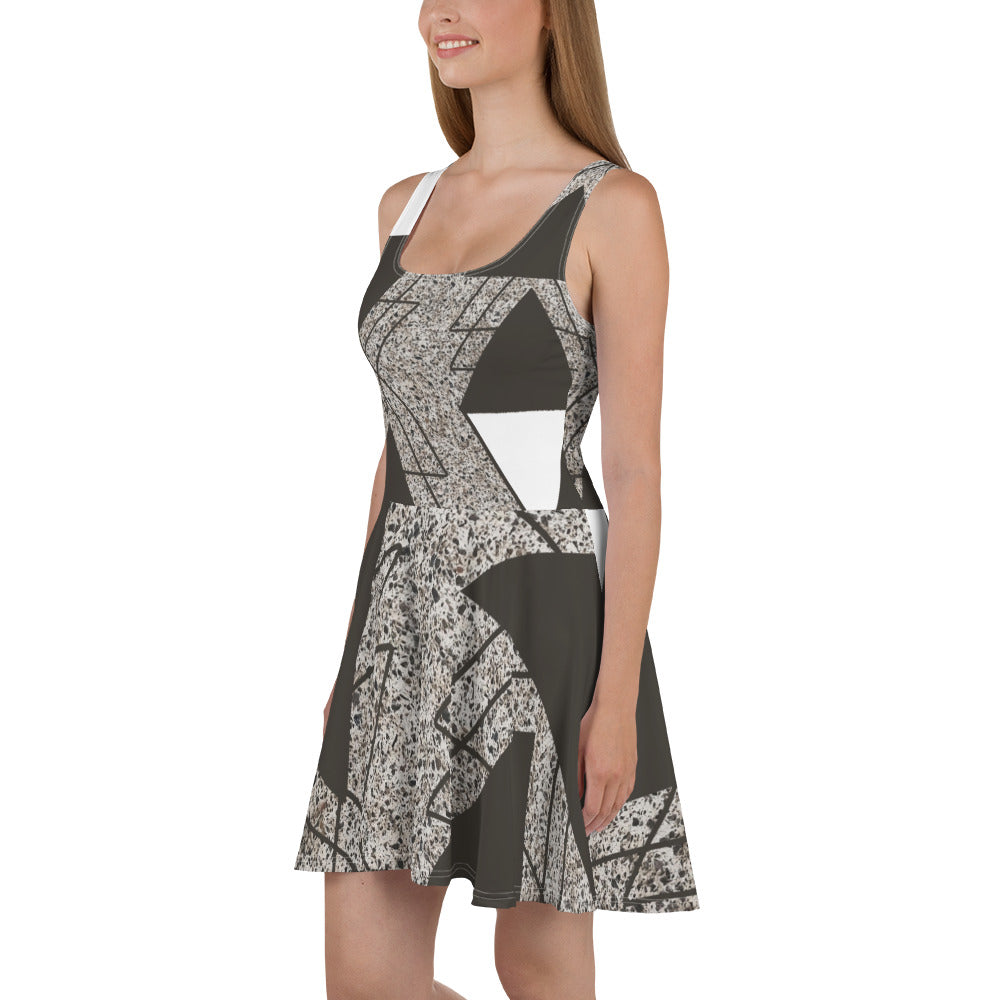 Women's skater dress featuring a brown and white triangular colorblock design, showcasing a flattering A-line silhouette and sleeveless style.