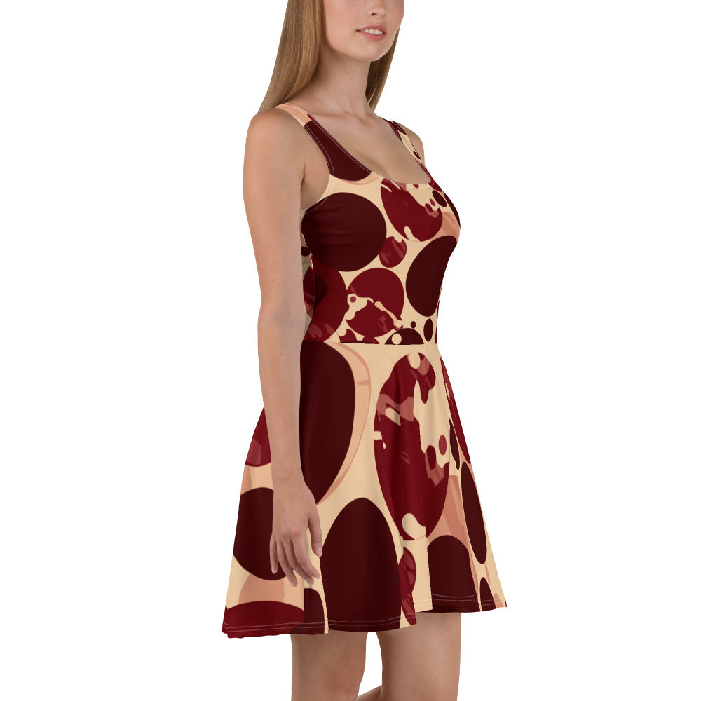 Women's skater dress in burgundy and beige with a circular print, featuring a flattering A-line silhouette and knee-length hem.