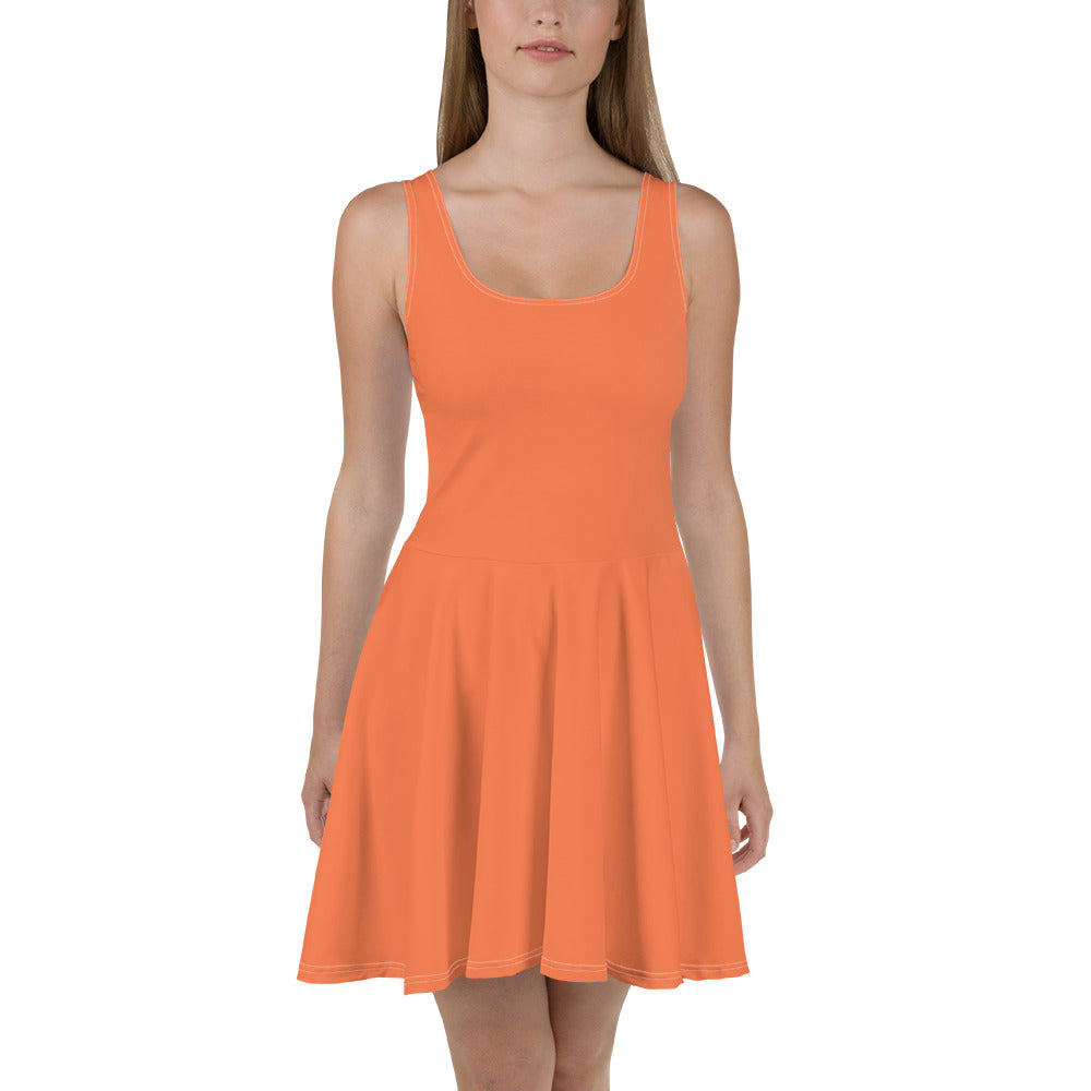 A vibrant coral orange red women's skater dress featuring an A-line silhouette, sleeveless design, and knee-length hem.