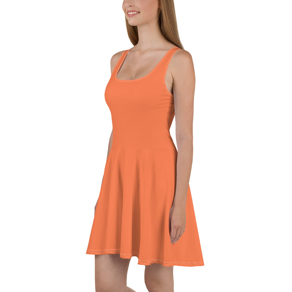 A vibrant coral orange red women's skater dress featuring an A-line silhouette, sleeveless design, and knee-length hem.