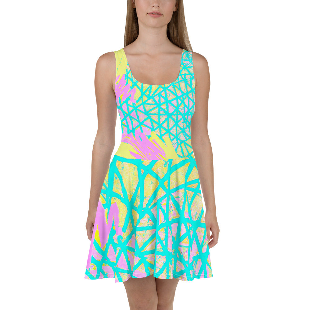 A vibrant Women's Skater Dress featuring a Cyan Blue, Lime Green, and Pink Pattern, showcasing its A-line silhouette and sleeveless design.