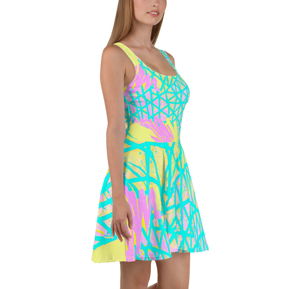 A vibrant Women's Skater Dress featuring a Cyan Blue, Lime Green, and Pink Pattern, showcasing its A-line silhouette and sleeveless design.