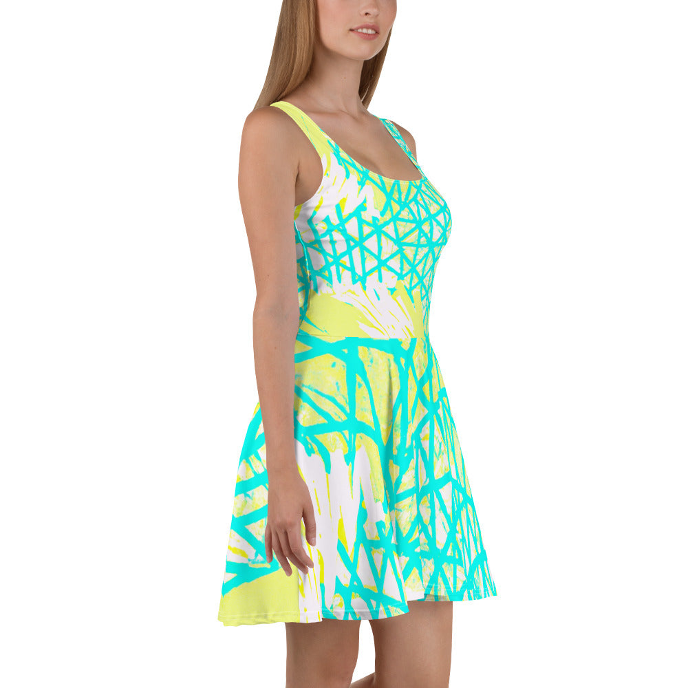 A stylish women's skater dress featuring a vibrant cyan blue, lime green, and white pattern, showcasing a flattering A-line silhouette.