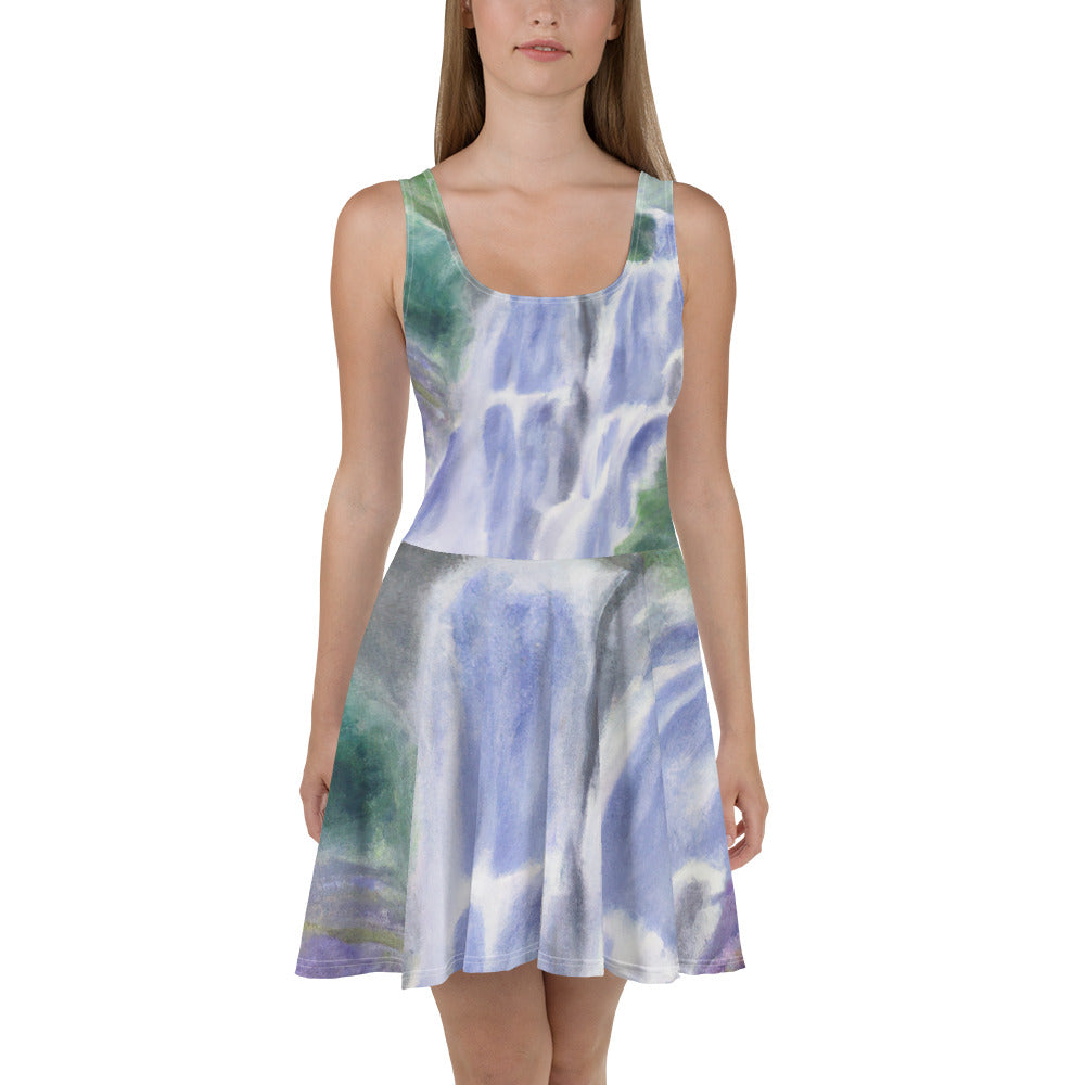 A stylish women's skater dress featuring a purple watercolor waterfall design with a green landscape, showcasing a flattering A-line silhouette.