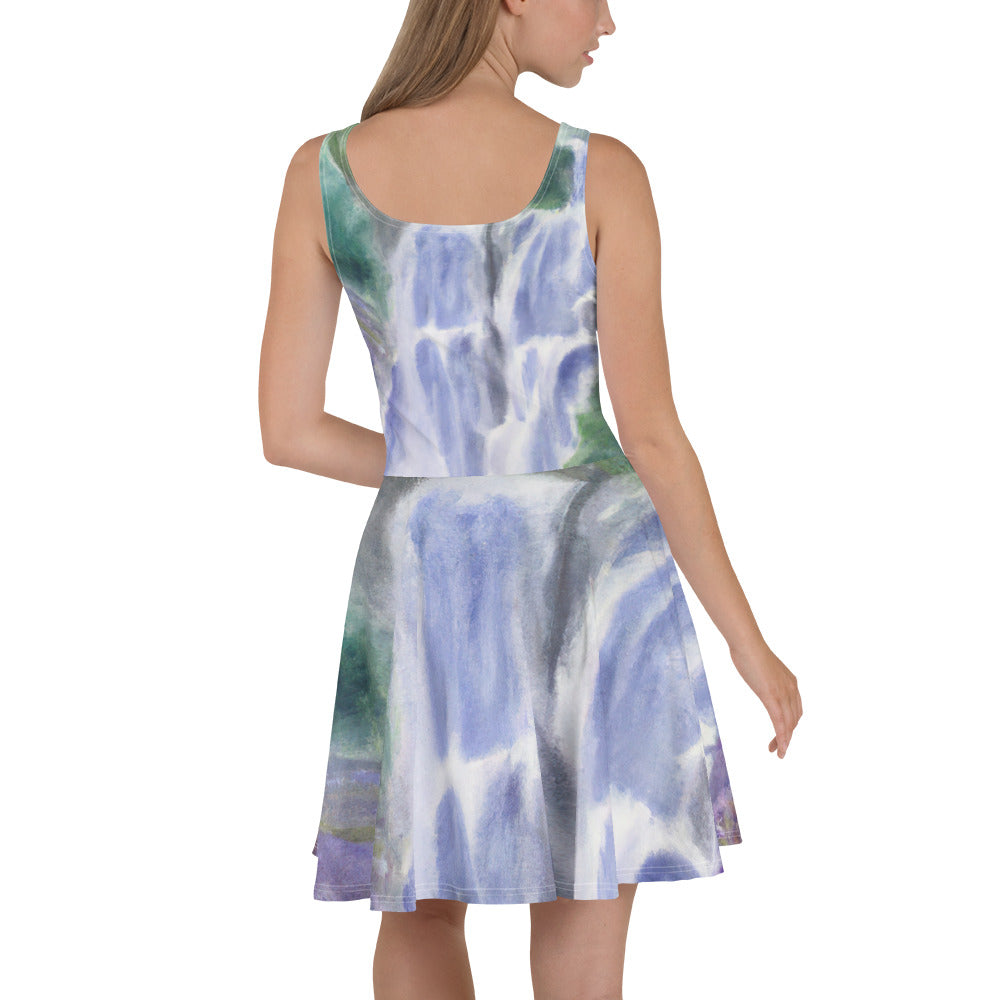 A stylish women's skater dress featuring a purple watercolor waterfall design with a green landscape, showcasing a flattering A-line silhouette.