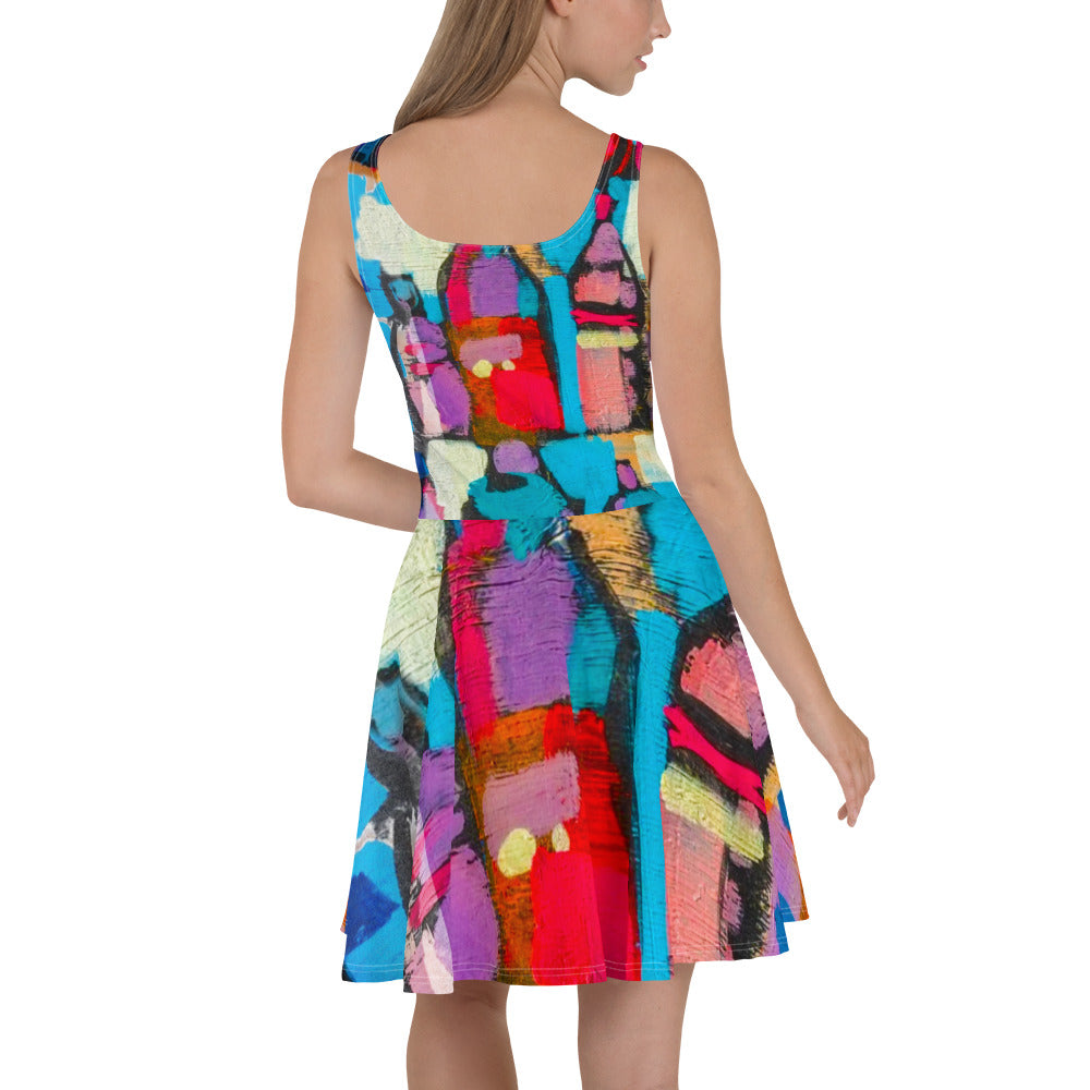 A vibrant women's skater dress featuring a Sutileza red multicolor abstract print, showcasing a flattering A-line silhouette and sleeveless design.