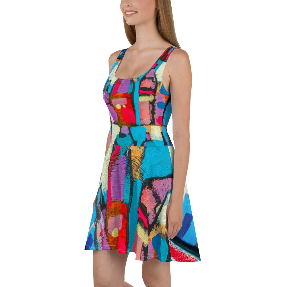 A vibrant women's skater dress featuring a Sutileza red multicolor abstract print, showcasing a flattering A-line silhouette and sleeveless design.