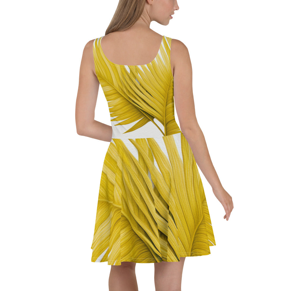 A stylish women's skater dress featuring a vibrant yellow palm leaves print, designed with a flattering A-line silhouette and sleeveless style.