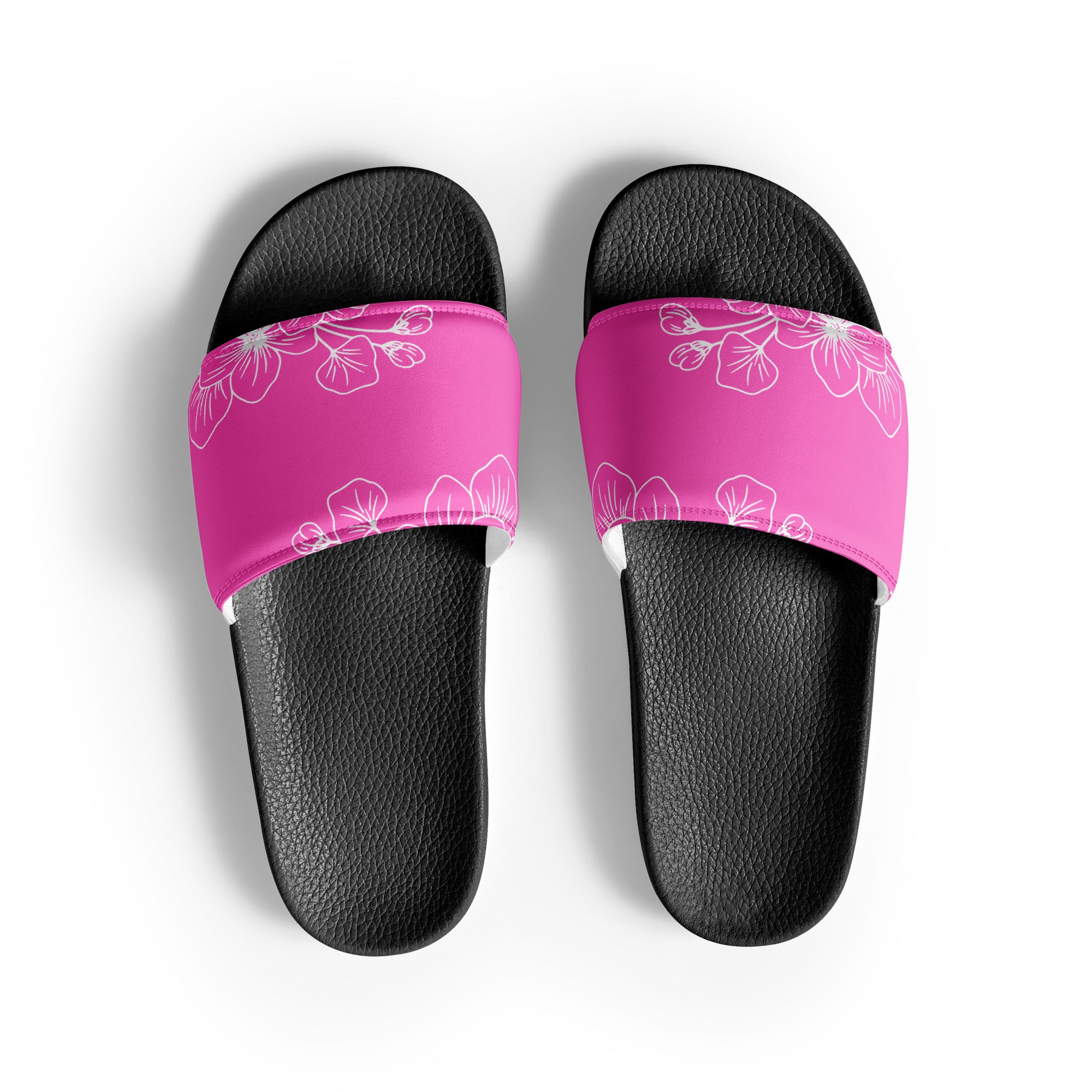 A pair of stylish women's slide sandals featuring a cushioned faux leather strap and textured footbed, perfect for summer activities.