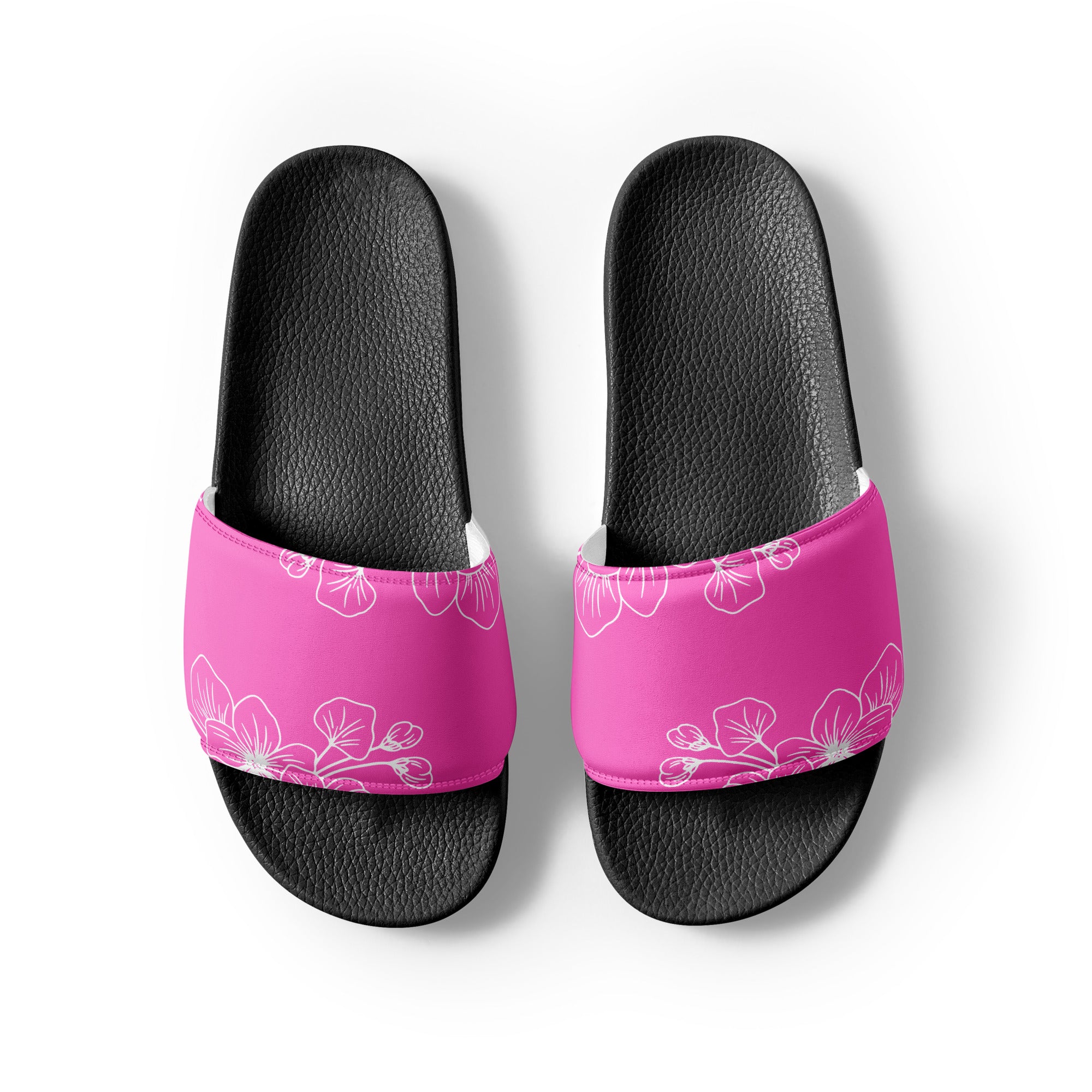 A pair of stylish women's slide sandals featuring a cushioned faux leather strap and textured footbed, perfect for summer activities.