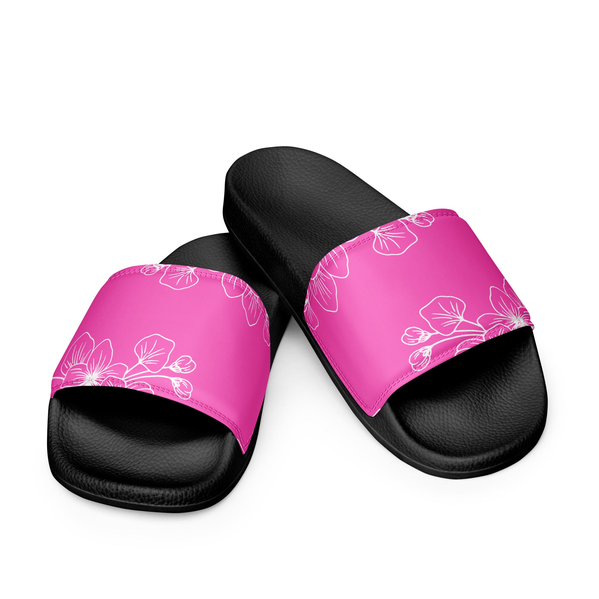 A pair of stylish women's slide sandals featuring a cushioned faux leather strap and textured footbed, perfect for summer activities.