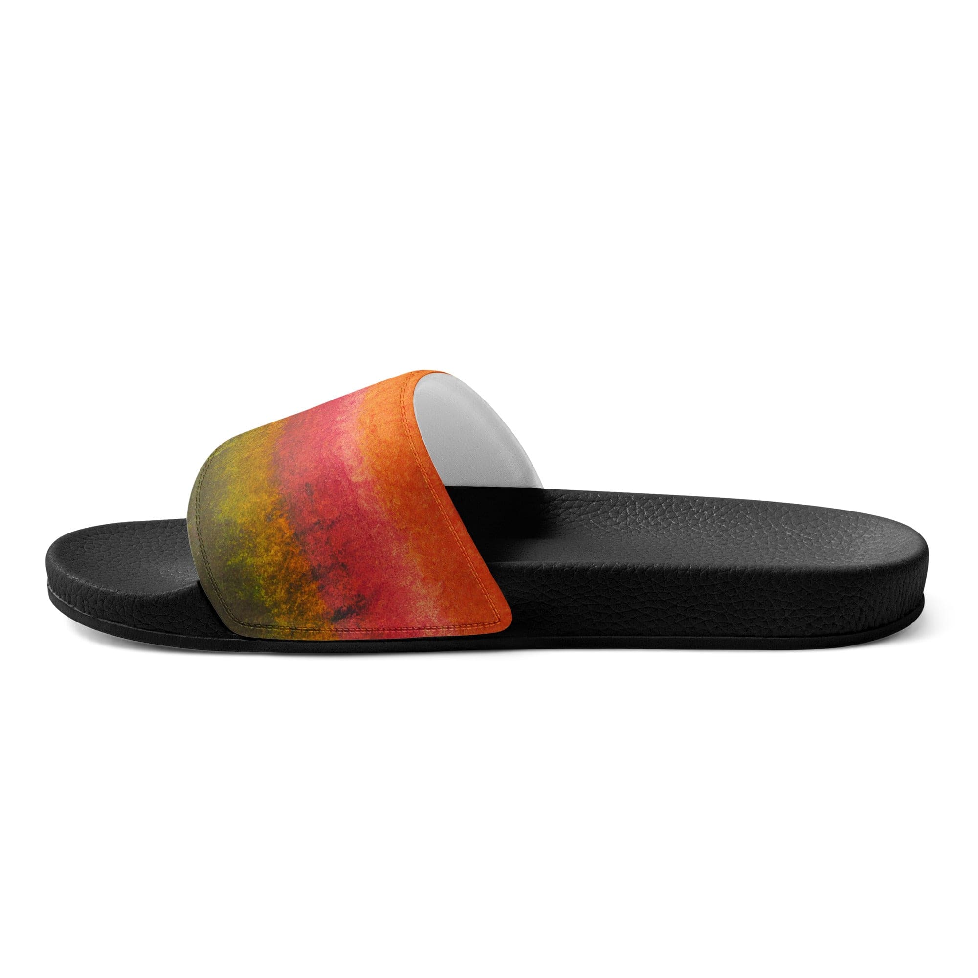 A pair of women's slides featuring a vibrant autumn fall watercolor abstract print, showcasing a cushioned faux leather strap and textured footbed.