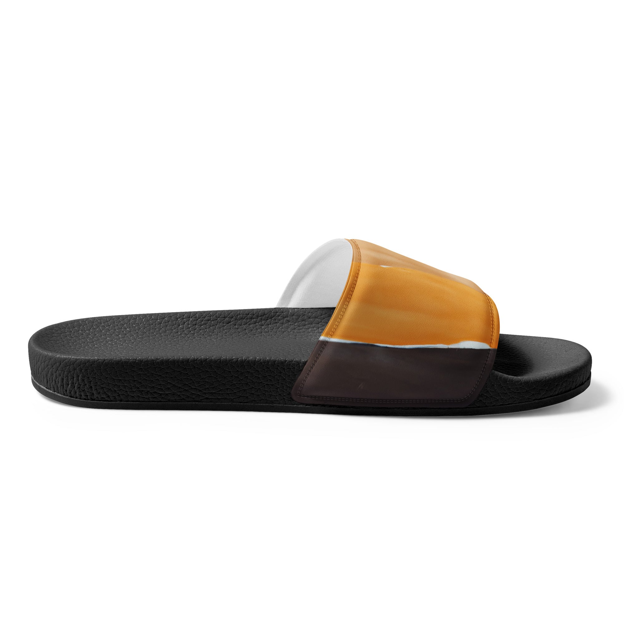 A pair of women's slides featuring a golden yellow and brown abstract pattern, showcasing a cushioned upper strap and textured footbed.