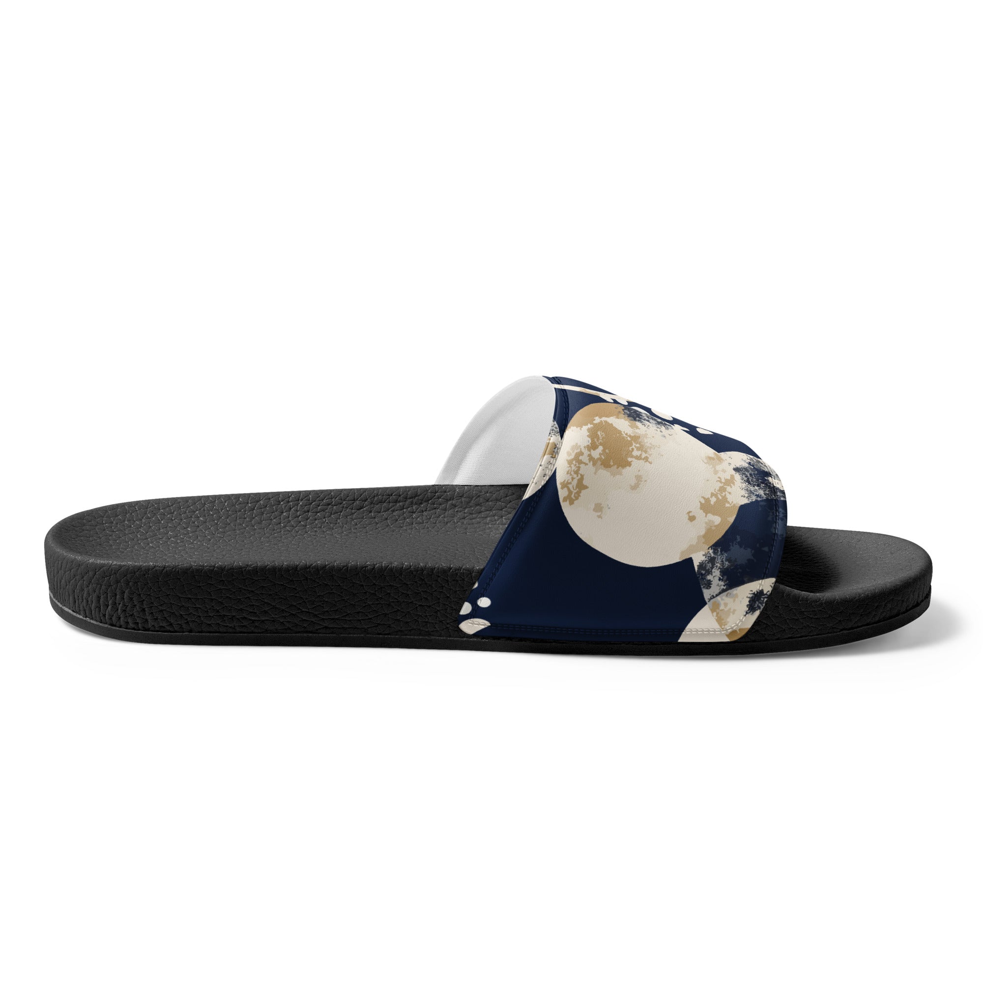 A pair of women's slides featuring a navy blue and beige spotted illustration, designed for comfort and style, perfect for summer activities.