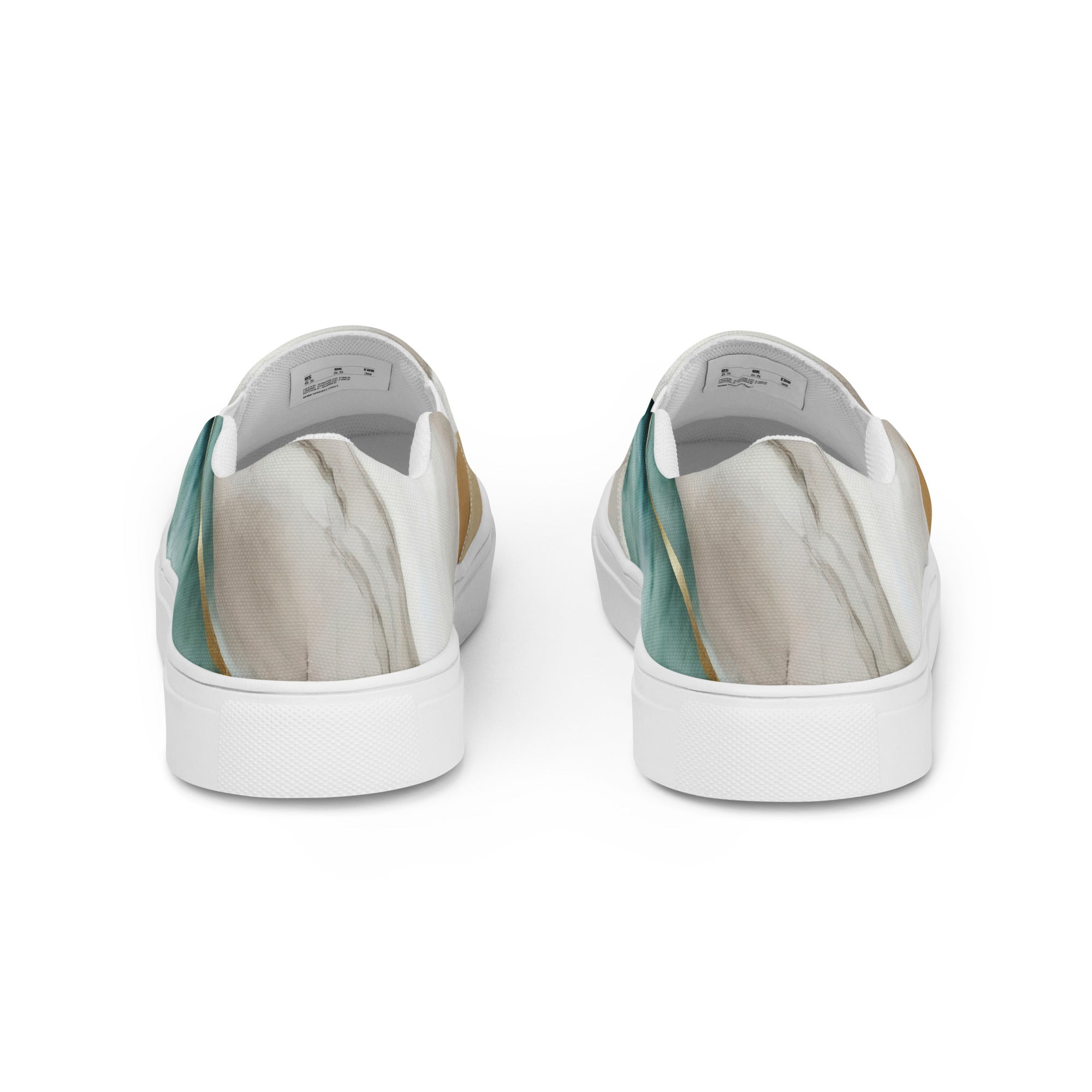 Womens slip-on canvas shoes in cream white and green marbled print, featuring elastic side goring and a durable rubber sole.