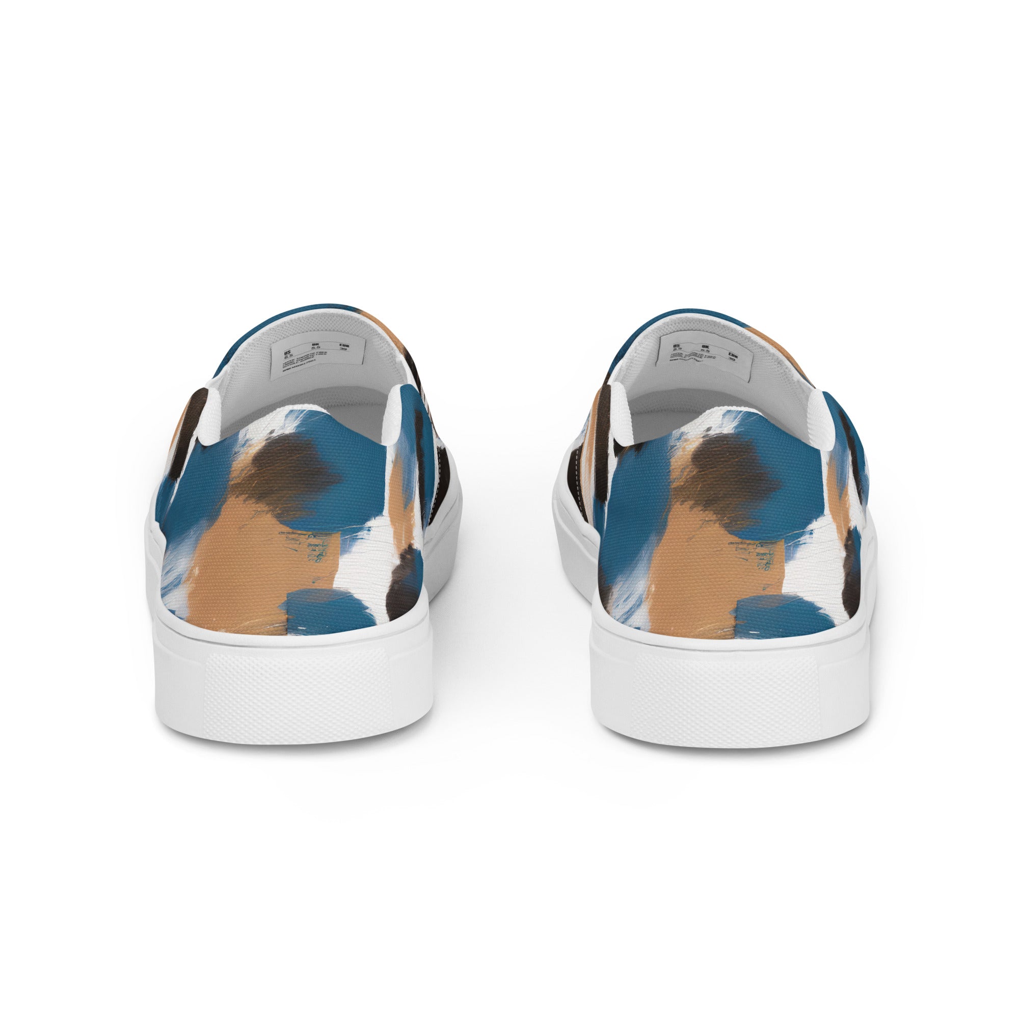 Womens slip-on canvas shoes featuring a spotted rustic brown, black, and blue abstract design, perfect for casual wear.