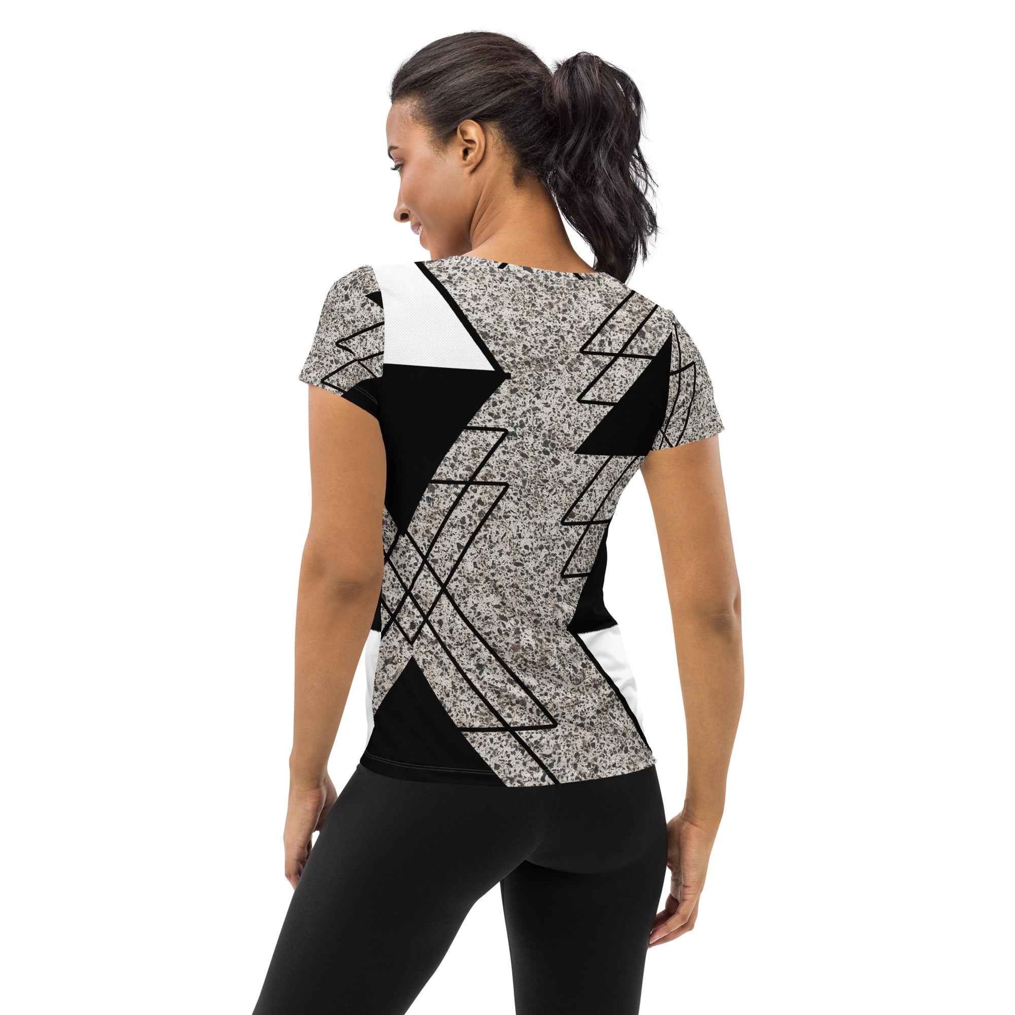 Women's Stretch Fit Athletic Sports T-shirt in black and white with a triangular colorblock design, showcasing its soft fabric and athletic silhouette.