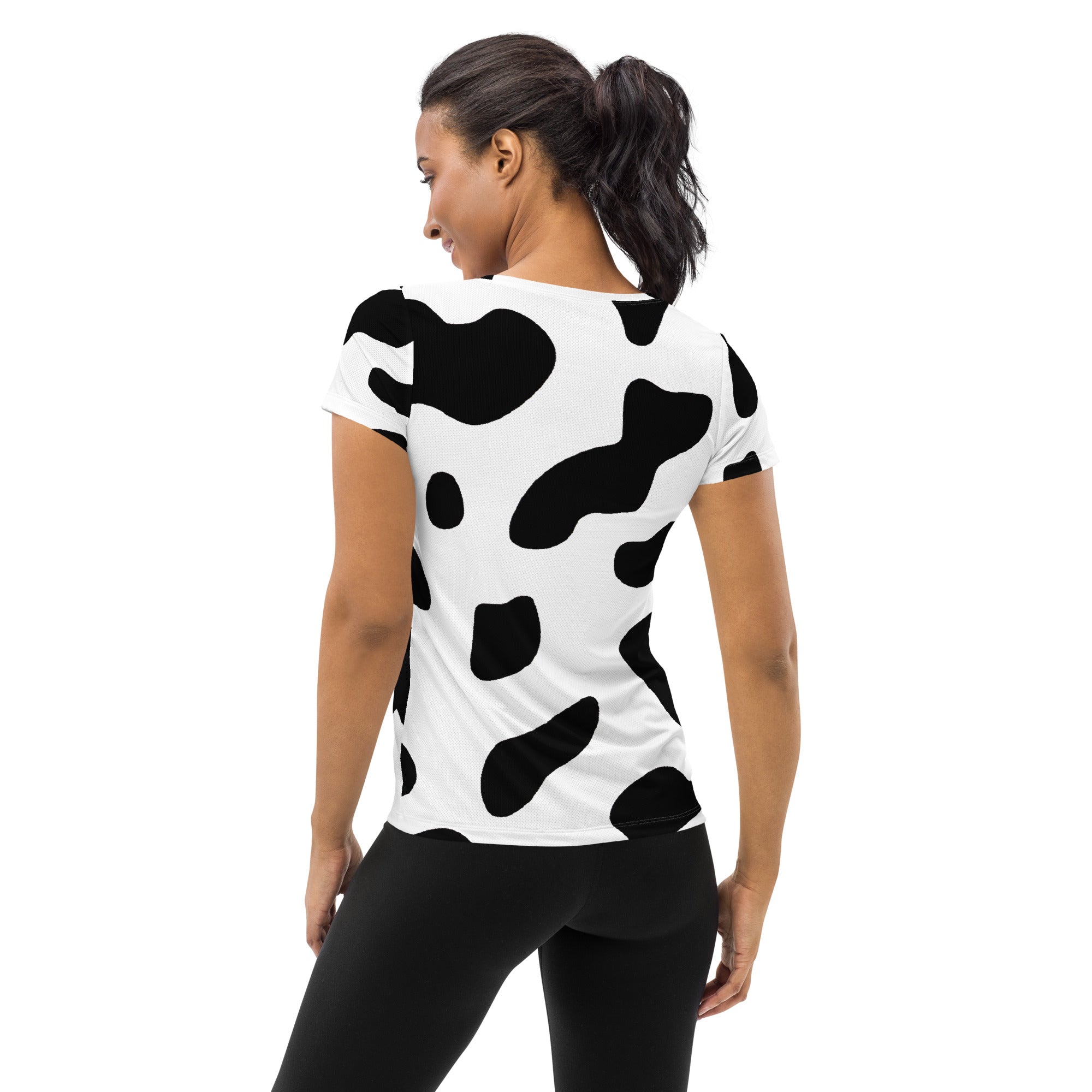 Women's Stretch Fit Athletic Sports T-shirt featuring a stylish black and white cow print, designed for comfort and performance during workouts.