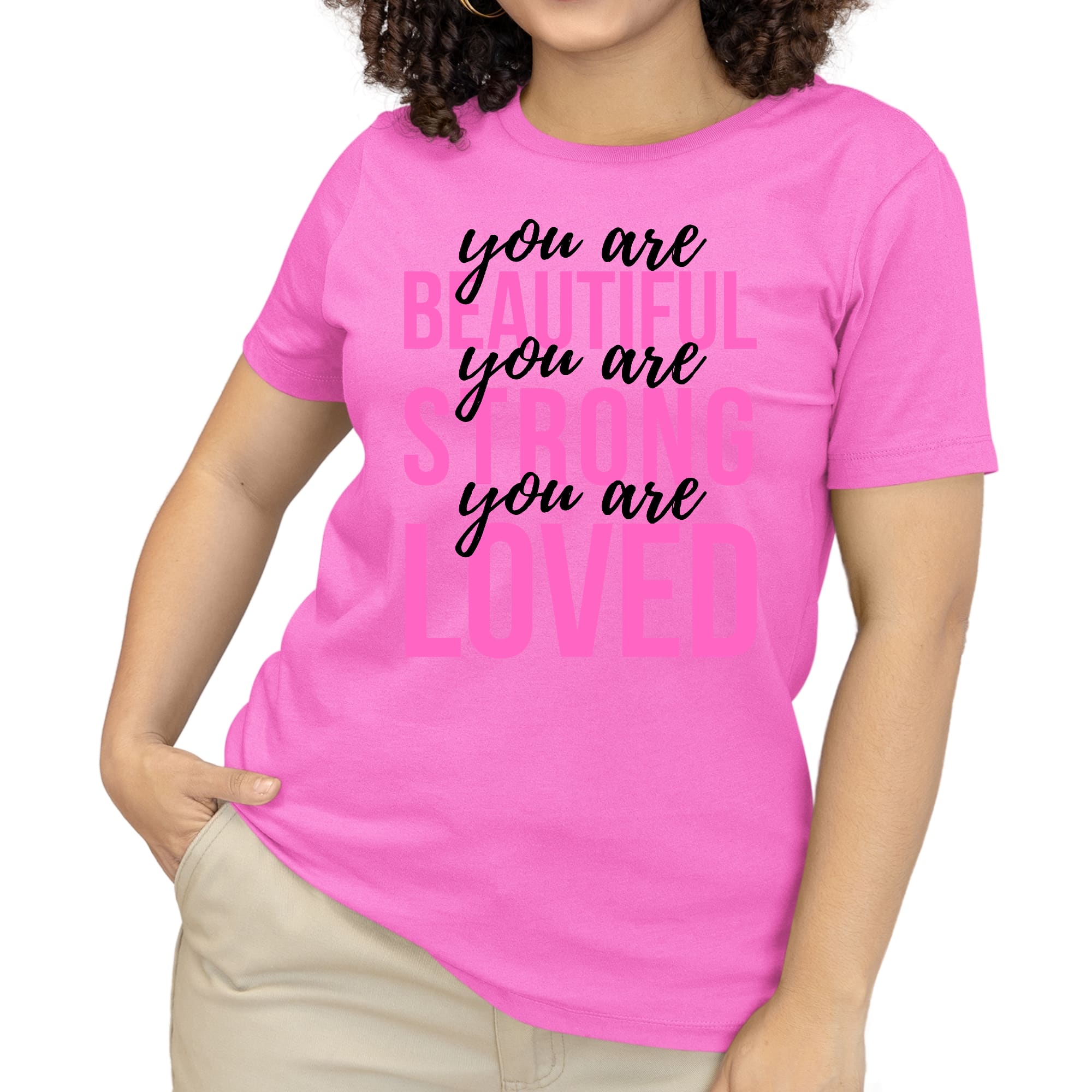 A pink women's T-shirt with the inspirational text 'You Are Beautiful Strong Loved' printed in black, showcasing a comfortable and stylish design.