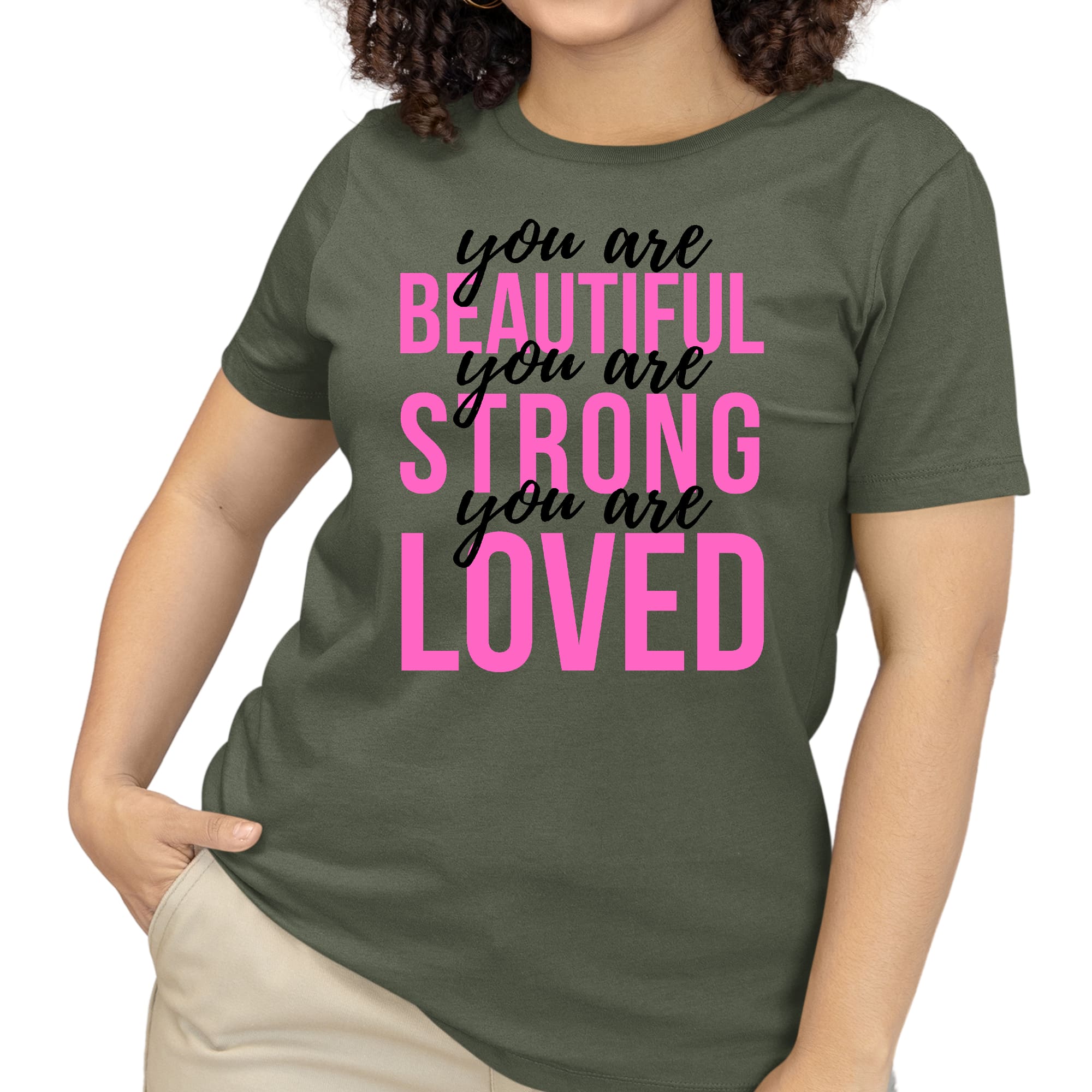 A pink women's T-shirt with the inspirational text 'You Are Beautiful Strong Loved' printed in black, showcasing a comfortable and stylish design.