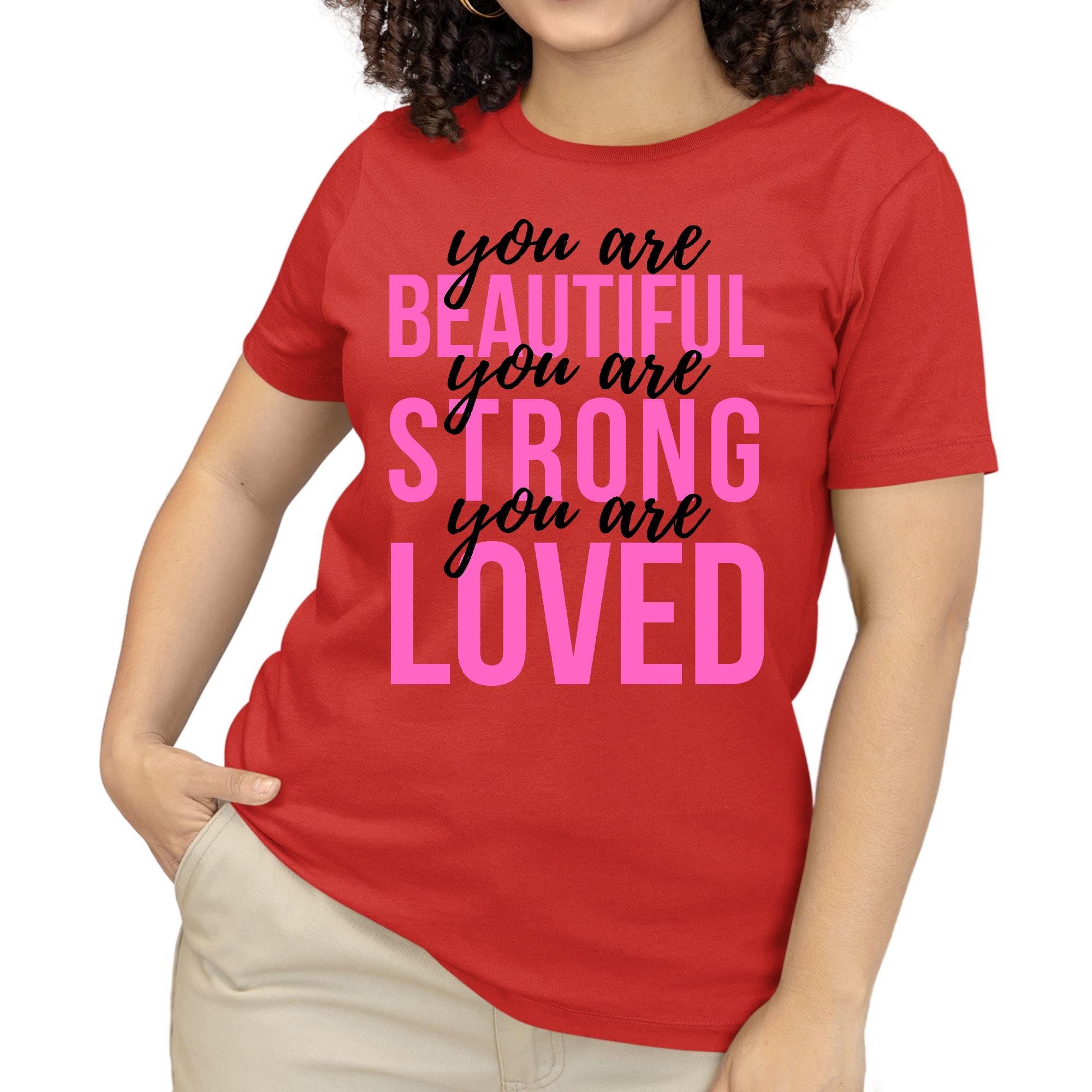 A pink women's T-shirt with the inspirational text 'You Are Beautiful Strong Loved' printed in black, showcasing a comfortable and stylish design.