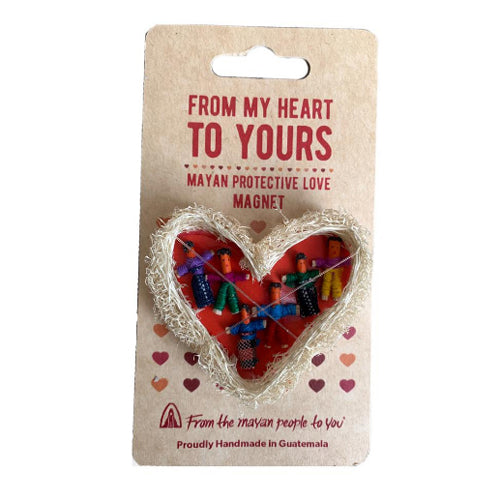 A colorful Worry Doll Loofah Magnet shaped like a heart, handmade by Mayan artisans, showcasing intricate designs and vibrant colors.