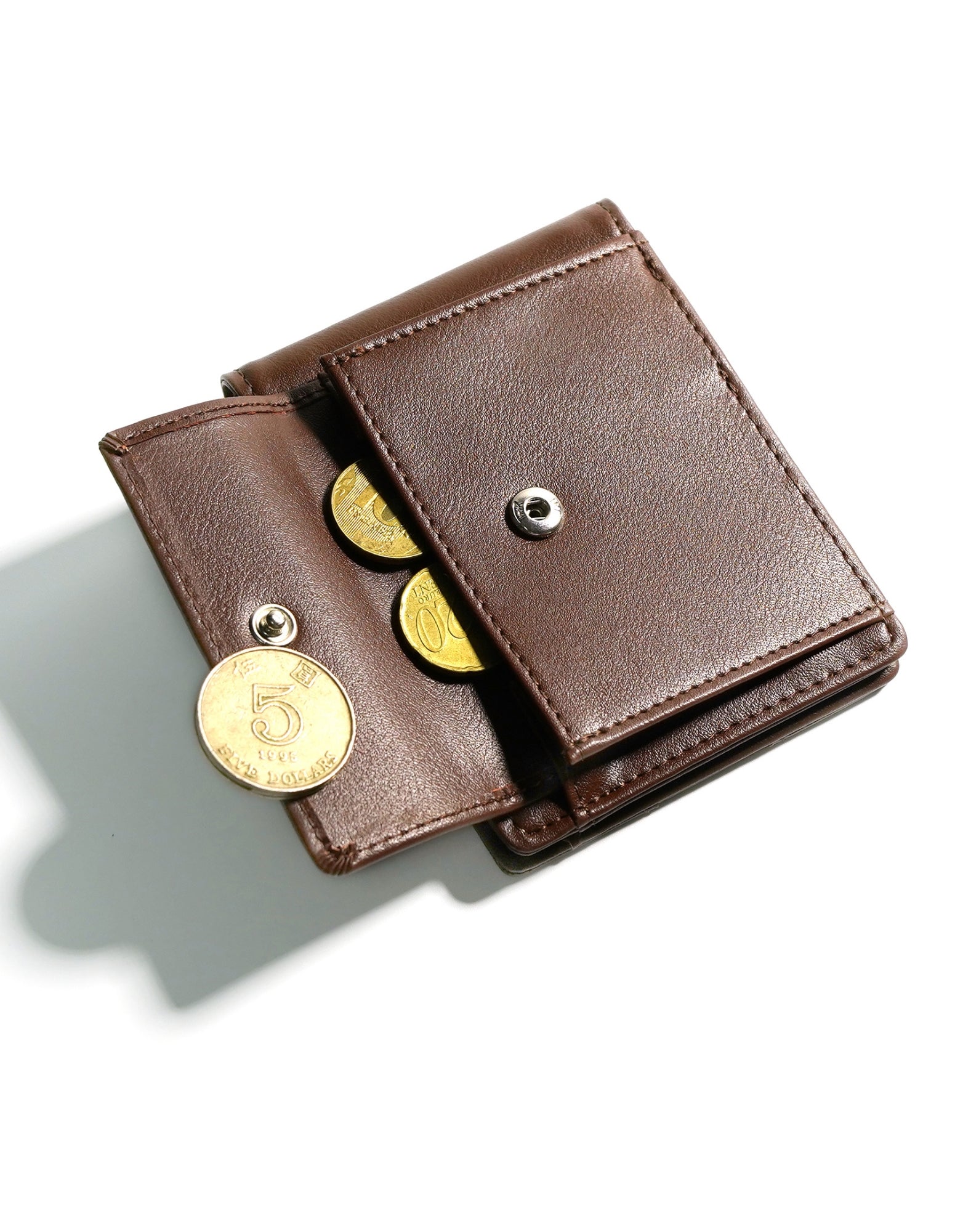 YAMBA Wallet in Brown, a vegan leather bifold wallet with a money clip and coin pocket, showcasing its sleek design and eco-friendly materials.