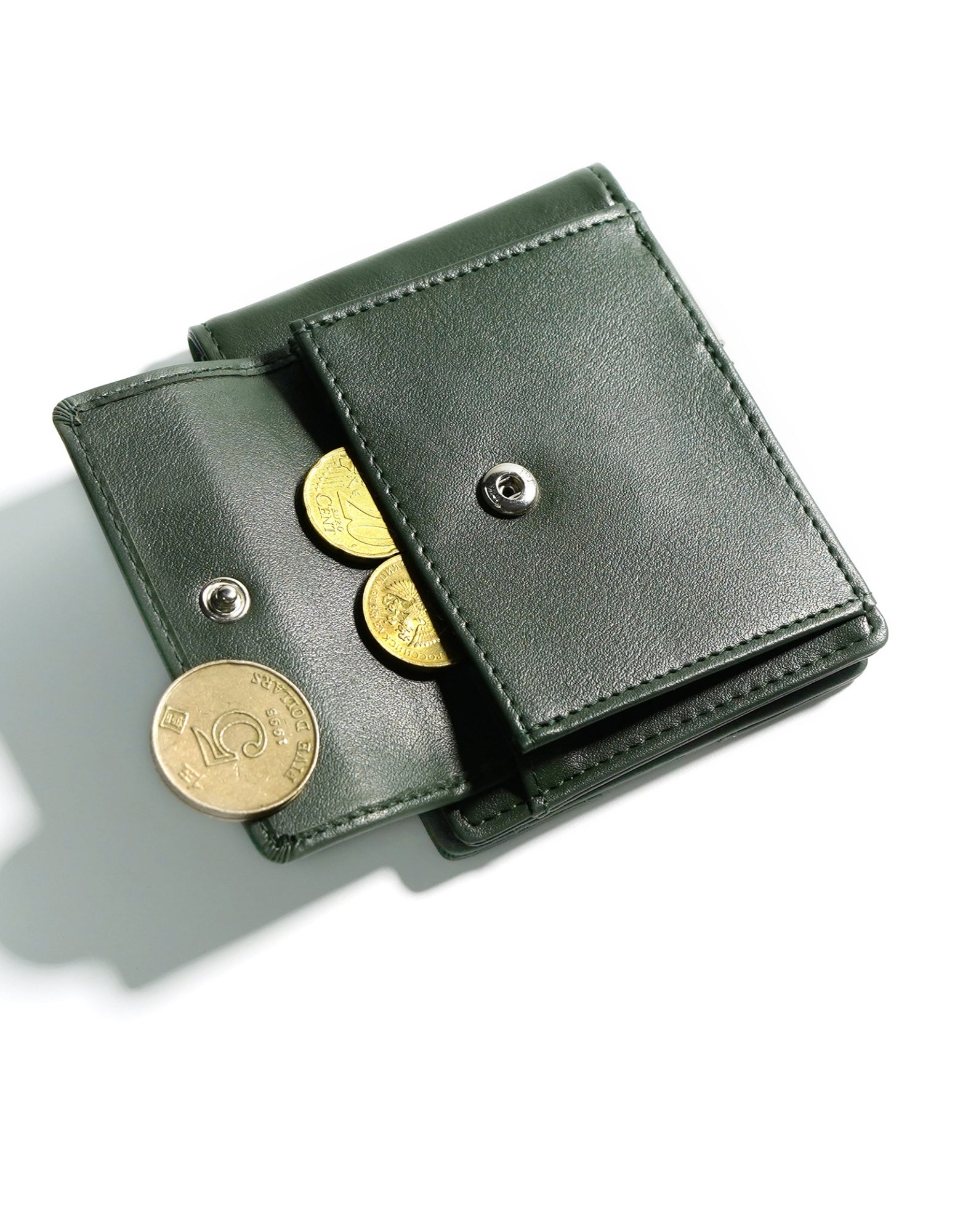 YAMBA Wallet I Green made from high-quality vegan leather, featuring a slim bifold design with a money clip and coin pocket.