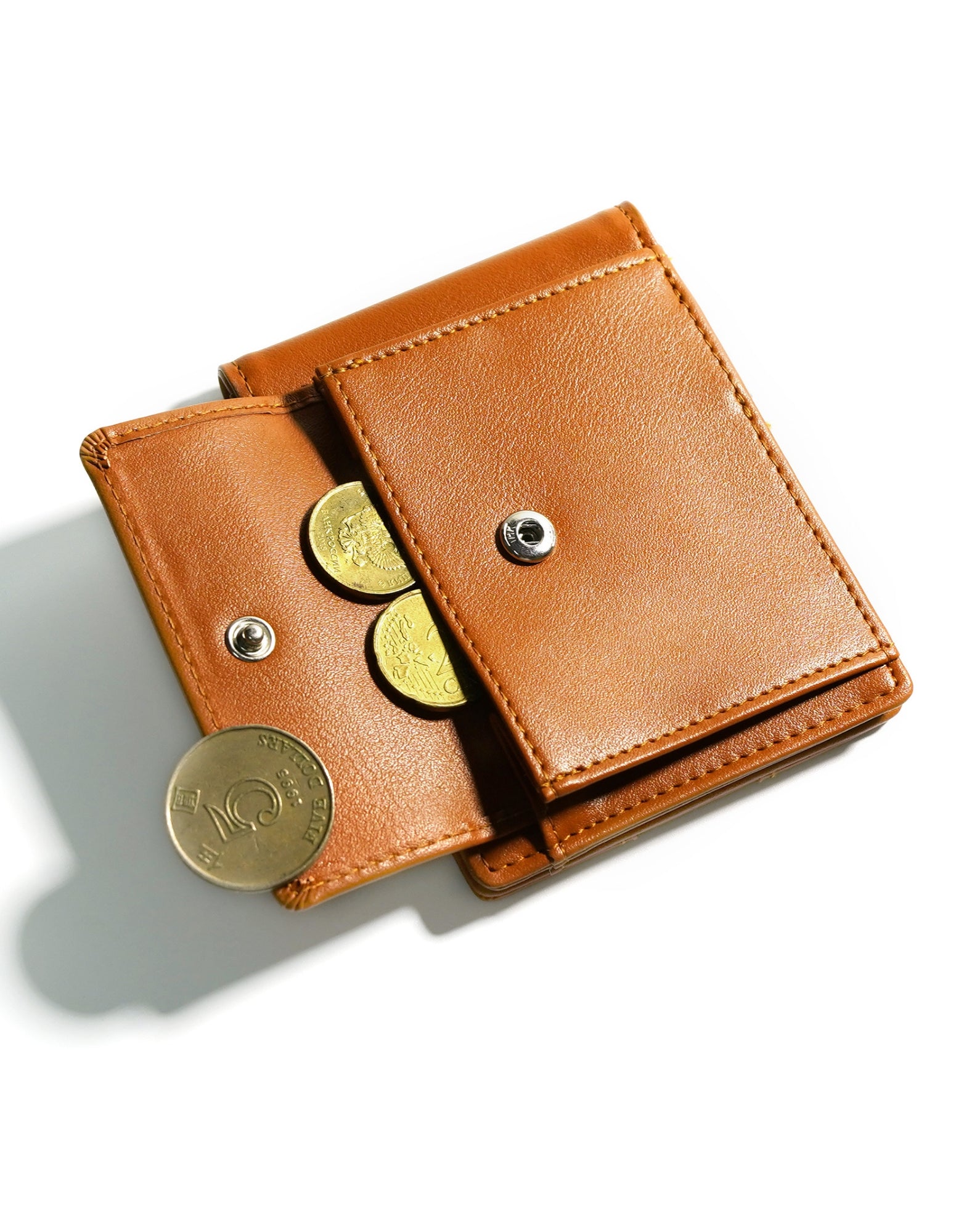 YAMBA Wallet I Tan made from high-quality vegan leather, featuring a slim bifold design with card slots, money clip, and coin pocket.