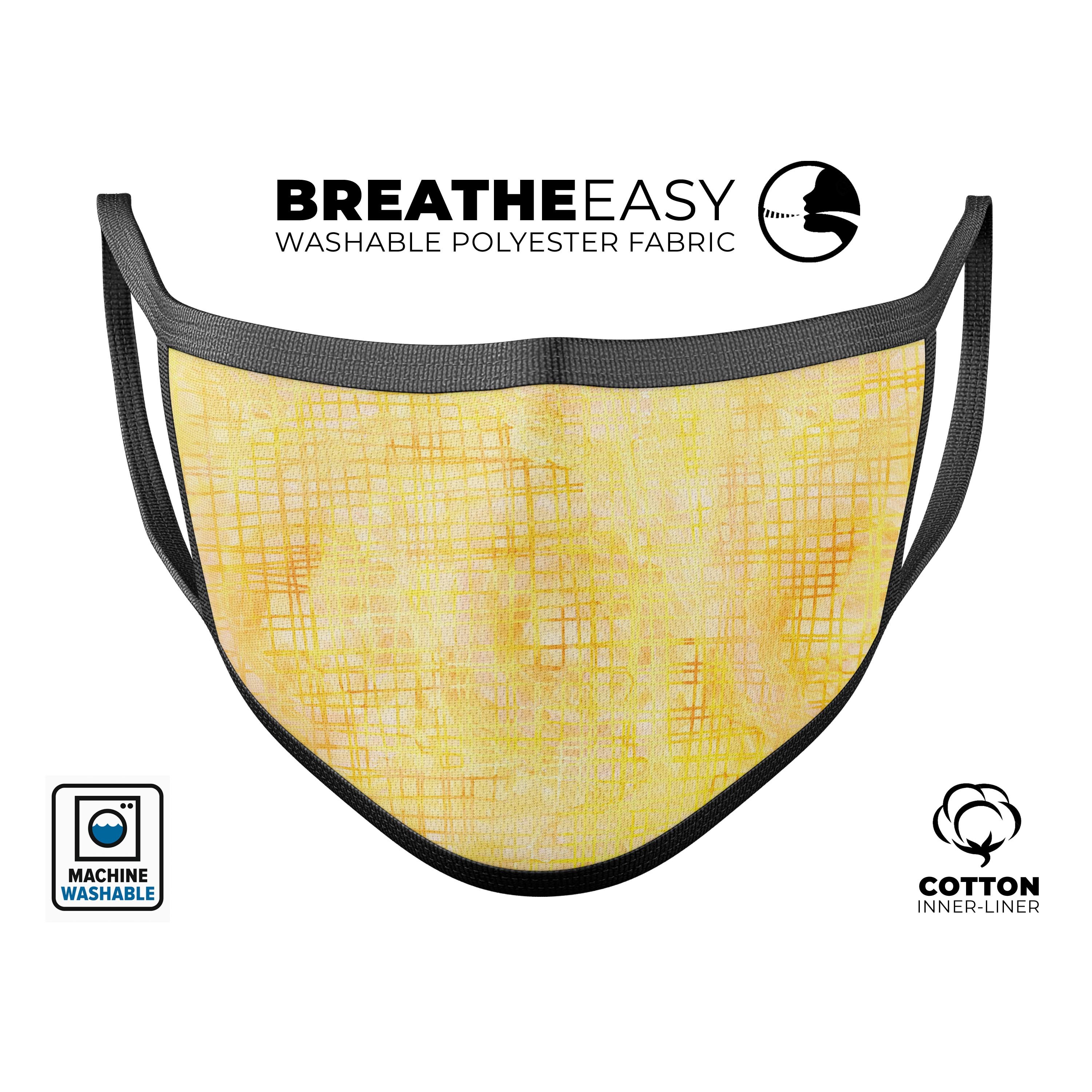 Yellow Watercolor Cross Hatch reusable mouth cover, featuring a vibrant design and adjustable ear loops for a comfortable fit.