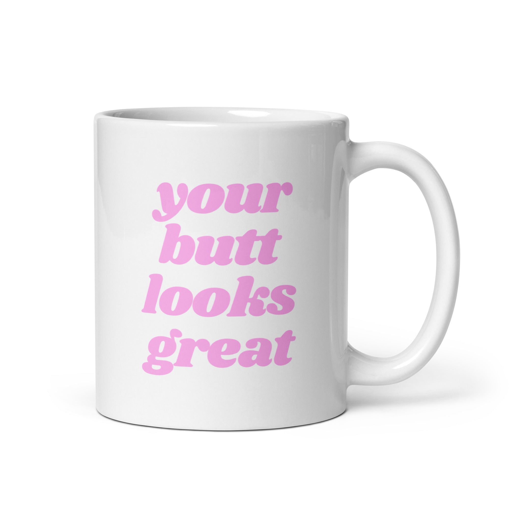 A glossy ceramic mug featuring a motivational print that reads 'Your Butt Looks Great', available in two sizes.