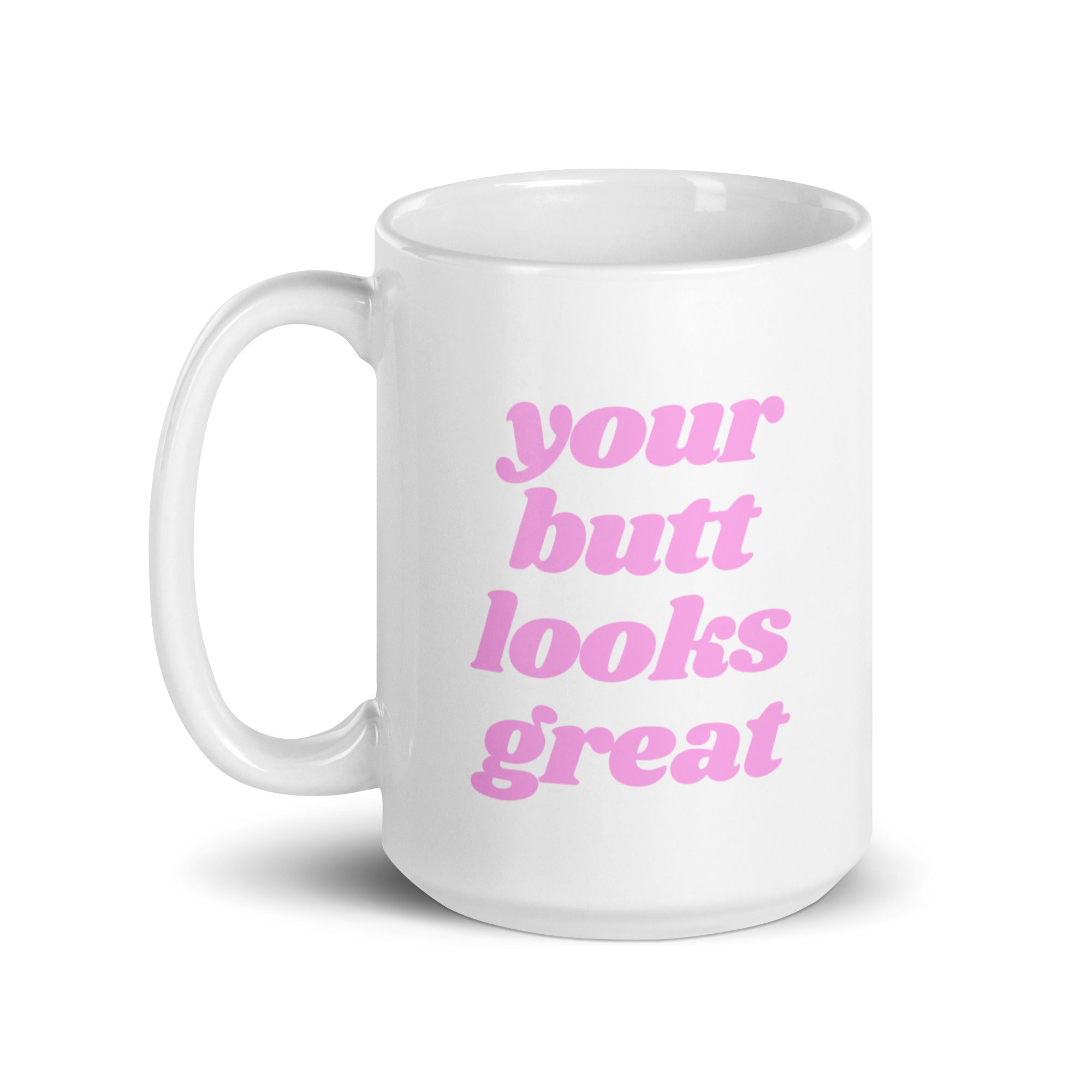 A glossy ceramic mug featuring a motivational print that reads 'Your Butt Looks Great', available in two sizes.