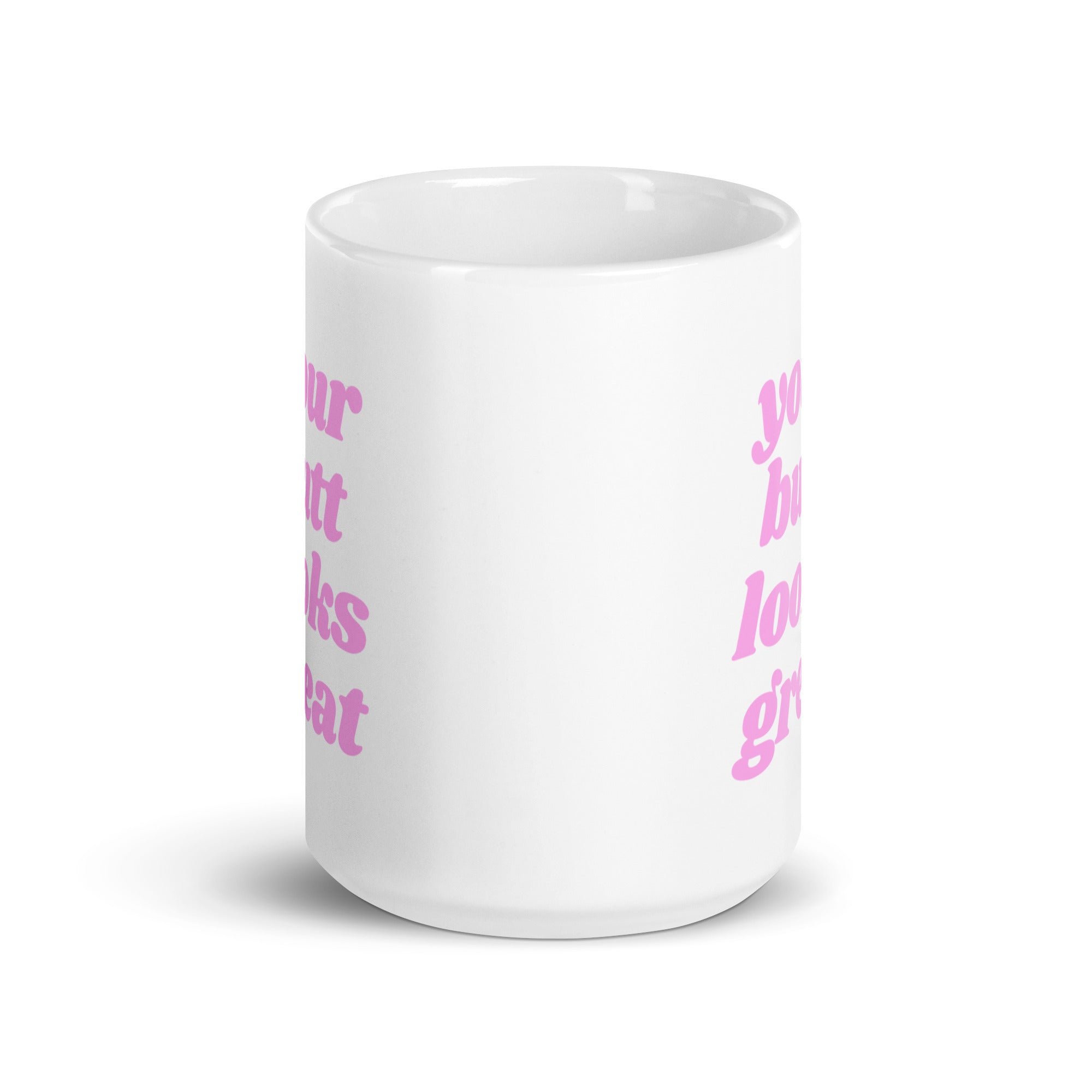 A glossy ceramic mug featuring a motivational print that reads 'Your Butt Looks Great', available in two sizes.