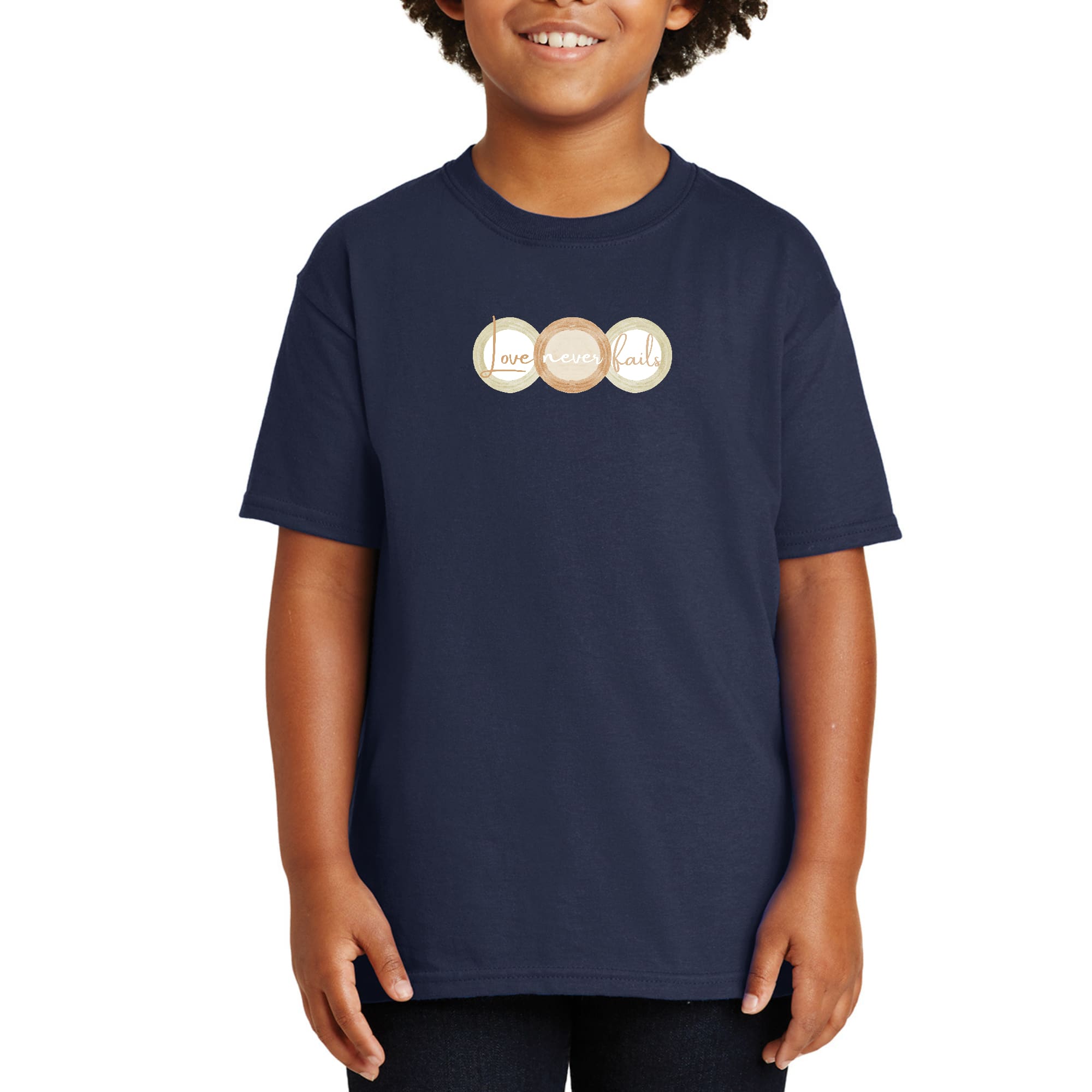 Youth Short Sleeve Graphic T-shirt in pastel brown featuring 'Love Never Fails' design with circular shapes.