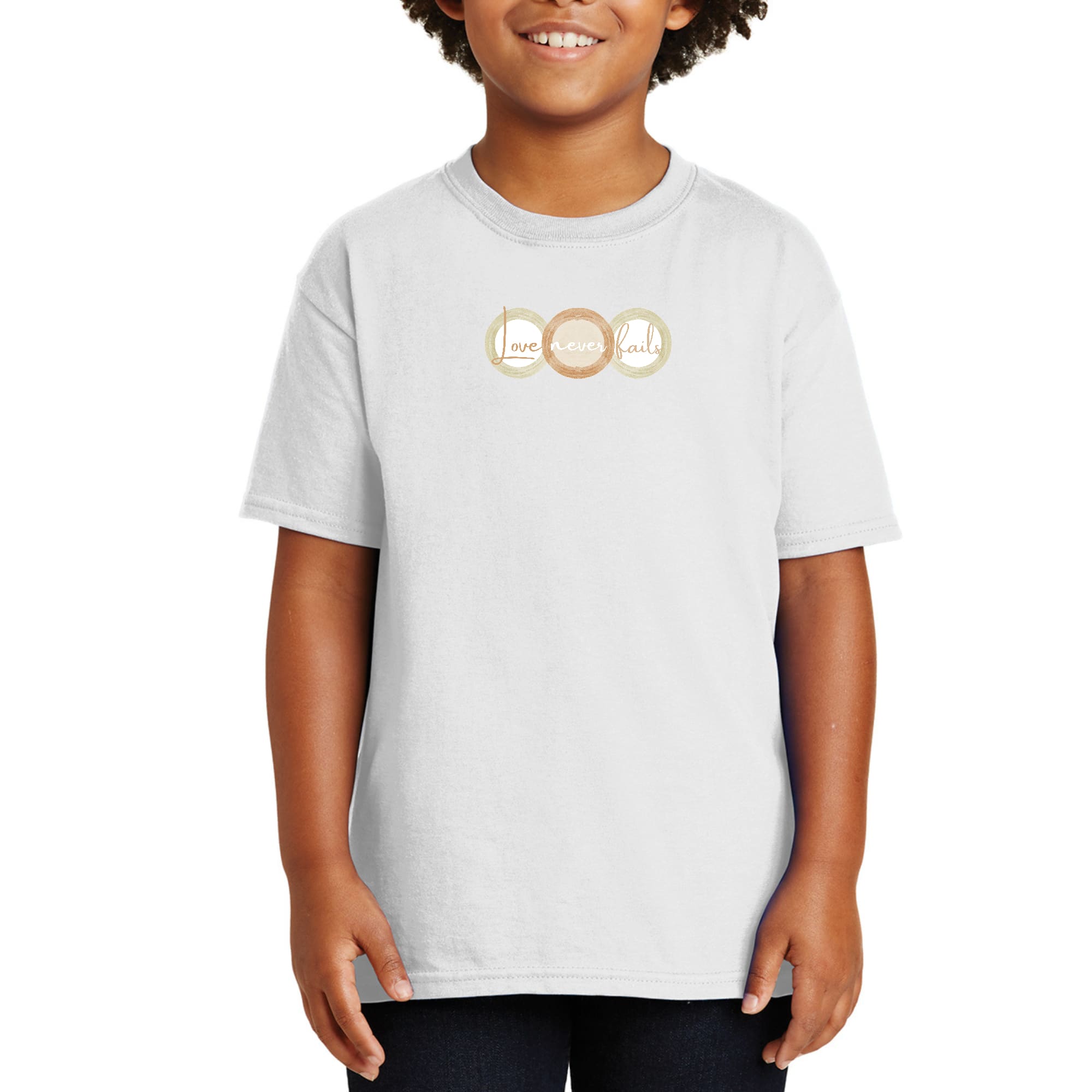 Youth Short Sleeve Graphic T-shirt in pastel brown featuring 'Love Never Fails' design with circular shapes.