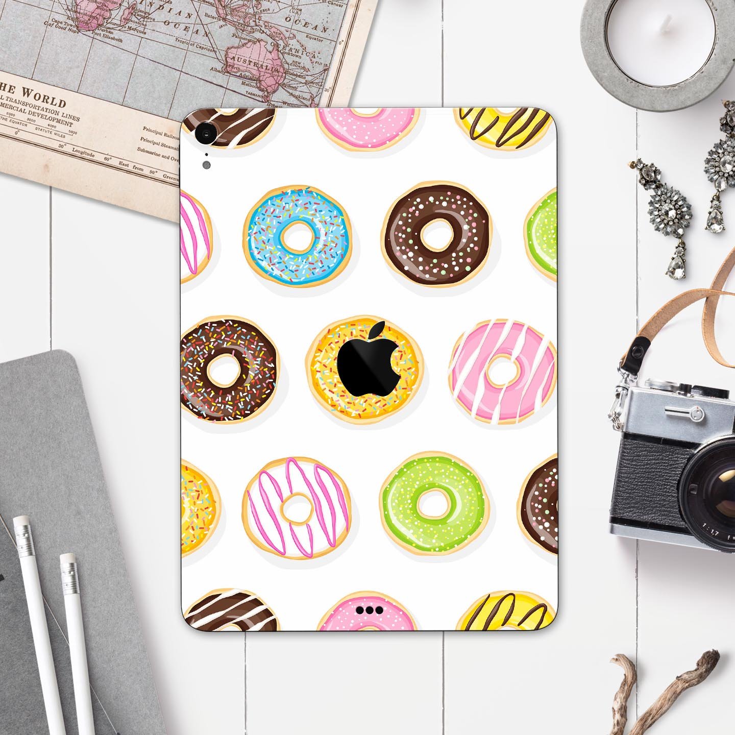 Yummy Colored Donuts Full Body Skin Decal for Apple iPad Pro, showcasing vibrant donut designs on a sleek surface.