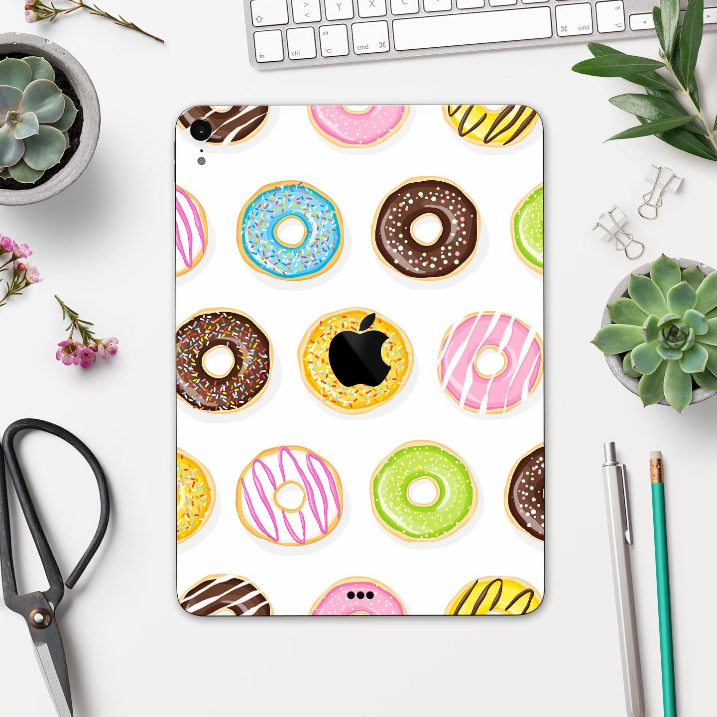 Yummy Colored Donuts Full Body Skin Decal for Apple iPad Pro, showcasing vibrant donut designs on a sleek surface.