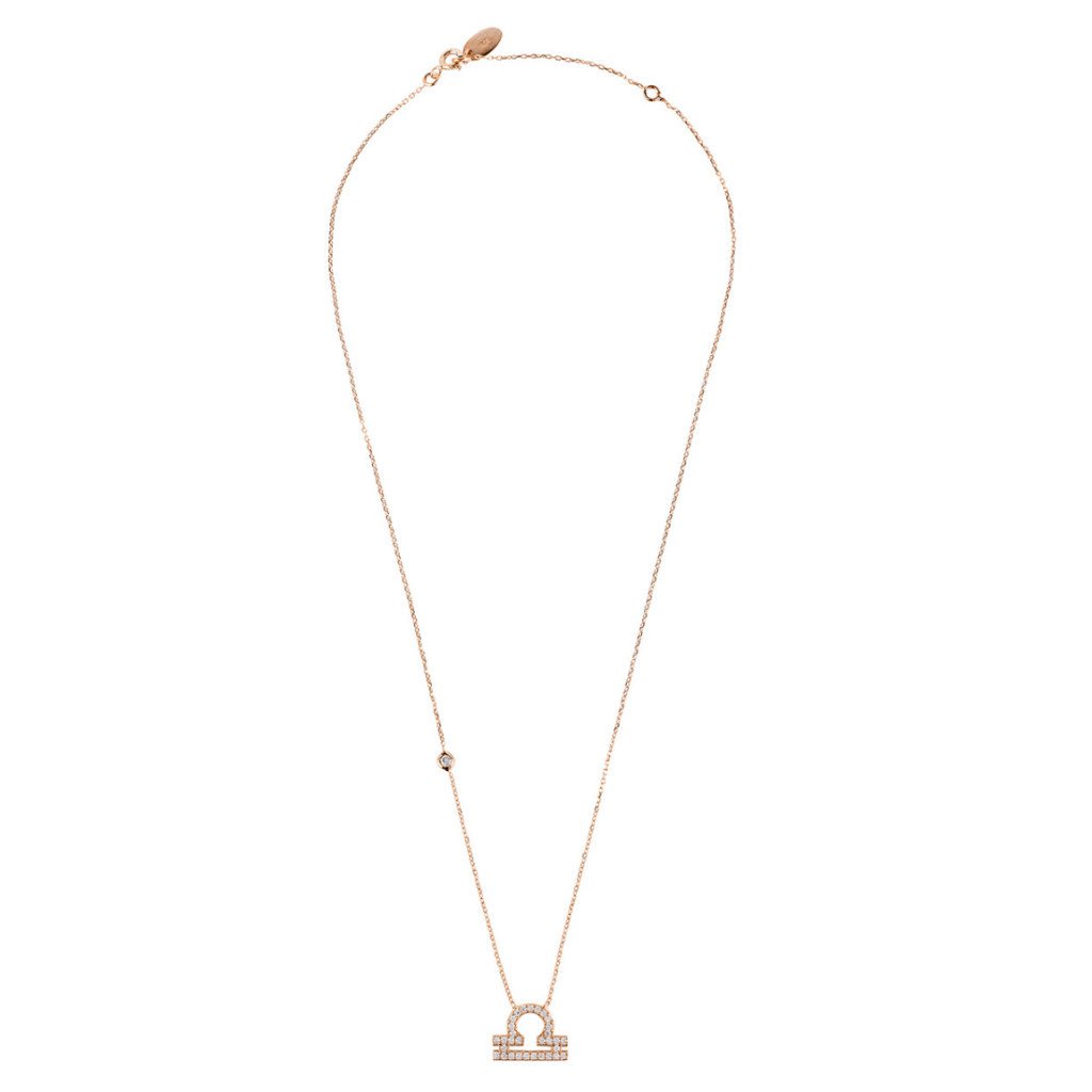 Rose gold Libra zodiac star sign pendant necklace with white zircons, displayed elegantly in a signature box.