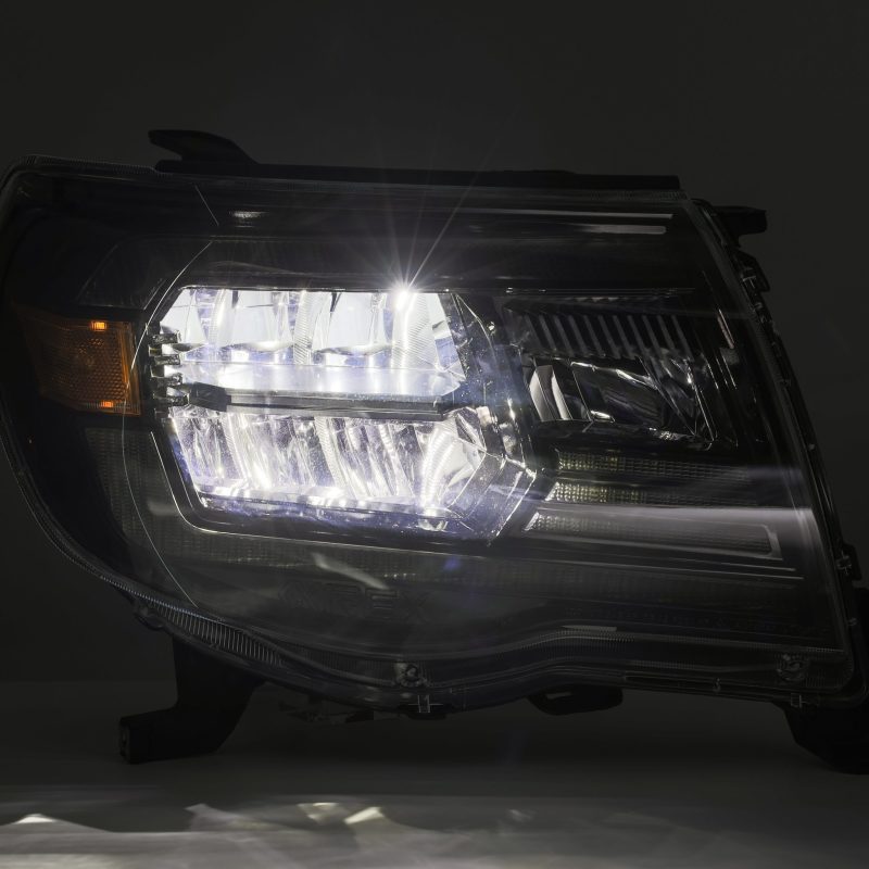 AlphaRex LUXX Crystal Headlights for 2005-2011 Toyota Tacoma, featuring a modern plank style design and clear lens for enhanced visibility.