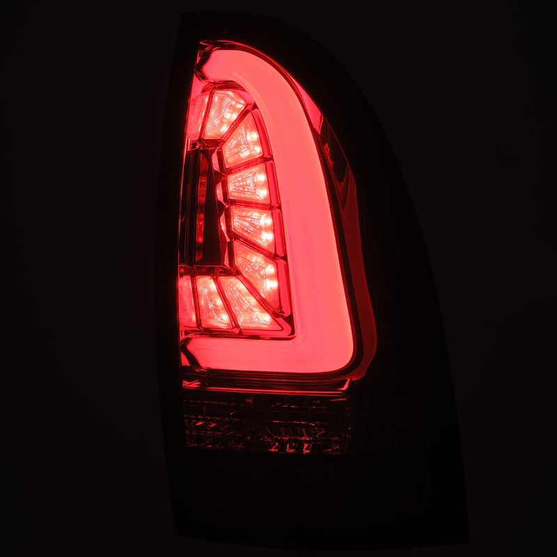 AlphaRex PRO-Series LED Tail Lights for 2005-2015 Toyota Tacoma in Red Smoke finish, showcasing modern design and superior visibility.