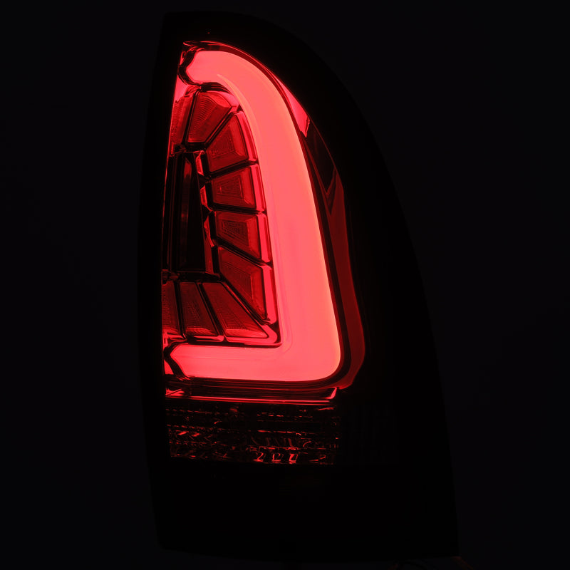 AlphaRex PRO-Series LED Tail Lights for 2005-2015 Toyota Tacoma in Red Smoke finish, showcasing modern design and superior visibility.