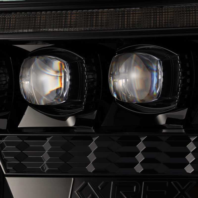 AlphaRex NOVA LED projector headlights for 2012-2015 Toyota Tacoma, featuring sleek black design and advanced lighting technology.