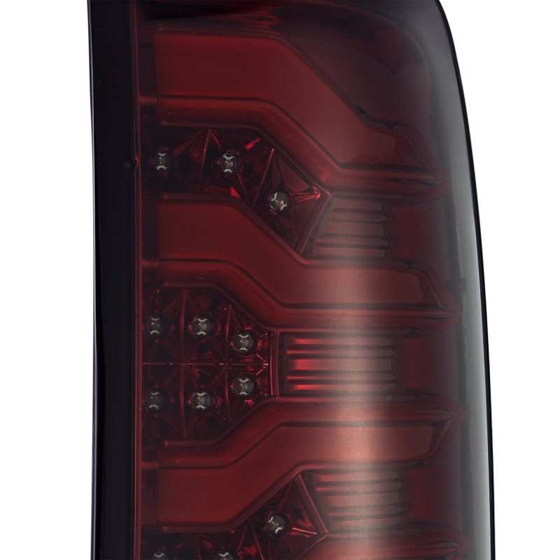 AlphaRex PRO-Series LED Tail Lights for GMC Sierra 1500 with red smoke lens, showcasing modern design and superior visibility.