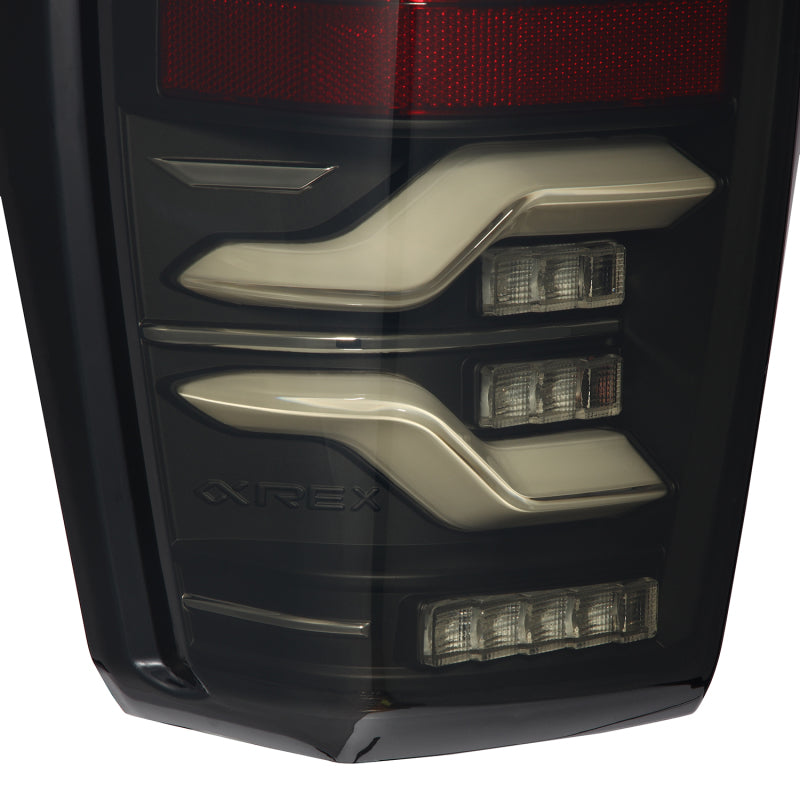 AlphaRex LUXX LED Taillights for 2016-2022 Toyota Tacoma in black, featuring sequential and active light technology.