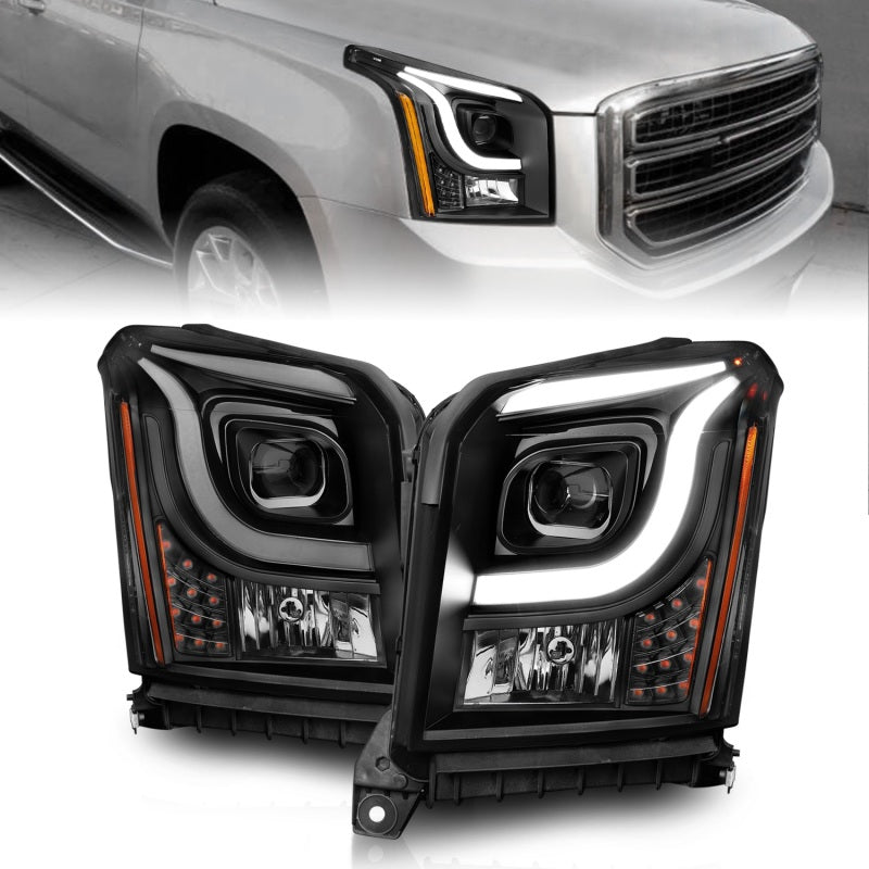 Anzo 15-17 GMC Yukon/Yukon XL projector headlights featuring black housing and clear lens for enhanced visibility.