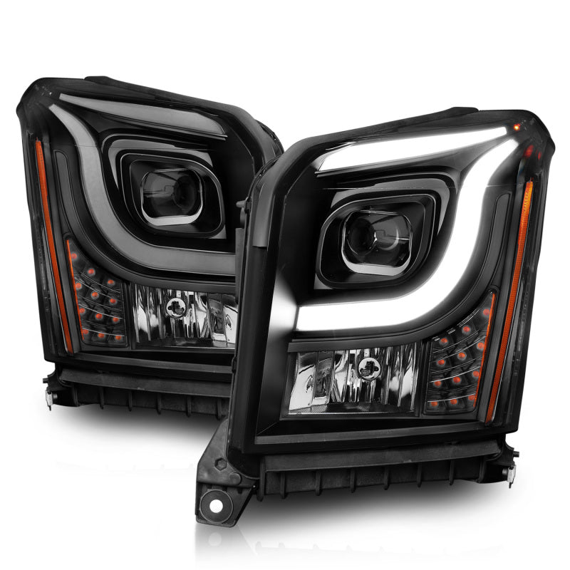 Anzo 15-17 GMC Yukon/Yukon XL projector headlights featuring black housing and clear lens for enhanced visibility.