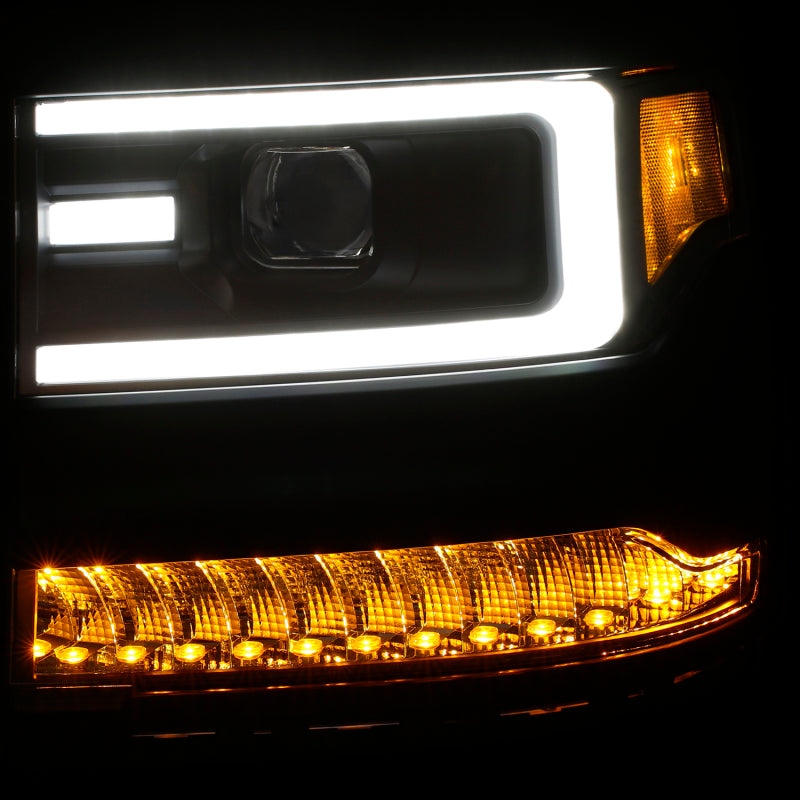 ANZO 16+ Chevy Silverado 1500 projector headlights with black housing and clear lens, showcasing modern design and enhanced visibility.