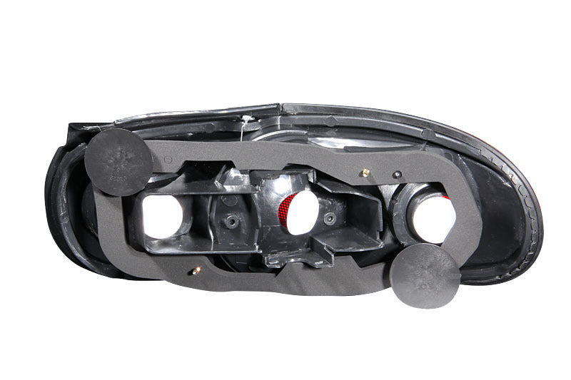 ANZO 1990-1997 Mazda Miata Taillights with black housing and clear lens, showcasing sleek design and modern aesthetics.