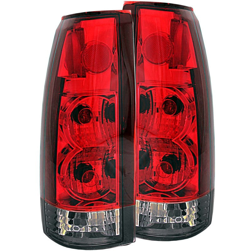 ANZO 1999-2000 Cadillac Escalade taillights with red and smoke lens, showcasing a sleek design for enhanced visibility and style.