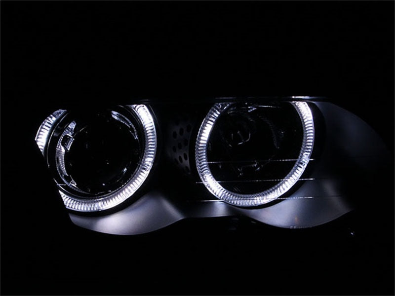 ANZO 1999-2001 BMW 3 Series E46 projector headlights with halo lights and black housing, showcasing modern design and clear lens.